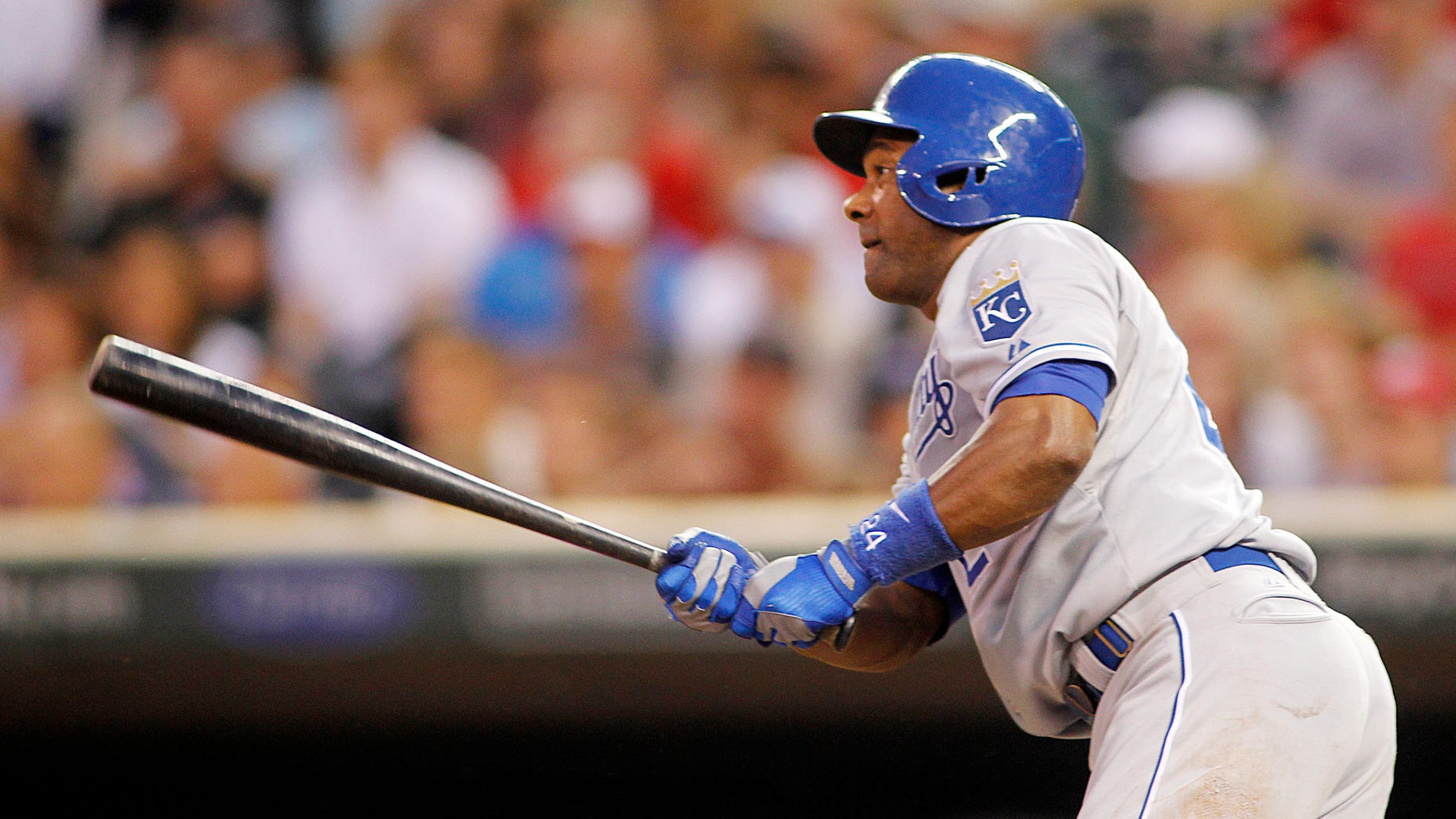 July 30, 2013: Kansas City Royals' Miguel Tejada watches his RBI single off Minnesota Twins pitcher Mike Pelfrey in the third inning of a baseball game in Minneapolis.