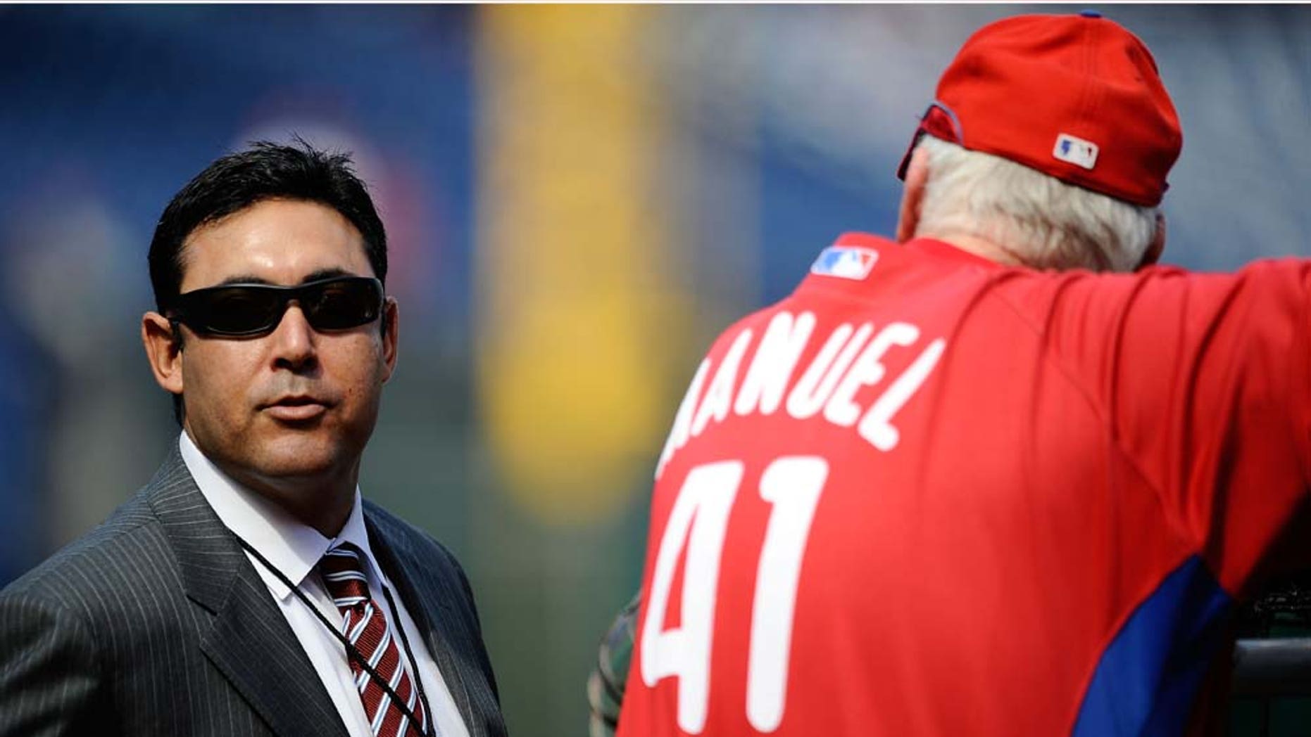 PHILADELPHIA - OCTOBER 08: General Manager Ruben Amaro Jr. of the Philadelphia Phillies talks with Phillies manager Charlie Manuel #41 on the field during batting practice prior to Game Two of the NLDS against the Colorado Rockies during the 2009 MLB Playoffs at Citizens Bank Park on October 8, 2009 in Philadelphia, Pennsylvania. (Photo by Jeff Zelevansky/Getty Images)