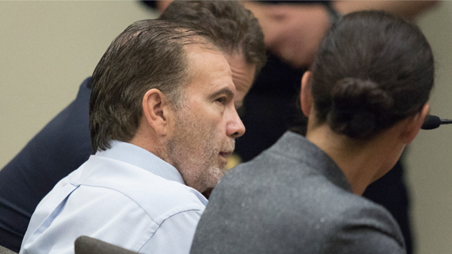 John Blaine Reed talks to his public defenders on Monday, Aug. 8, 2016, in Everett, Wash.