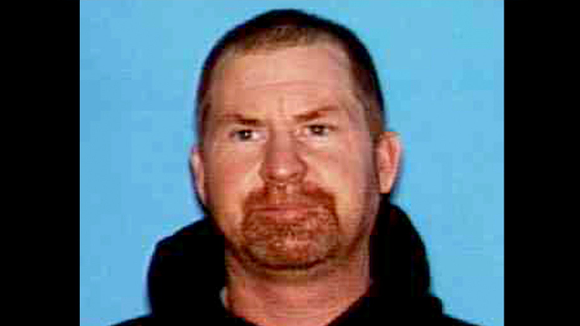 This undated photo released by the Shasta County Sheriff's office shows Shane Miller, 45, who is suspected of a triple homicide at his home in rural Northern California.