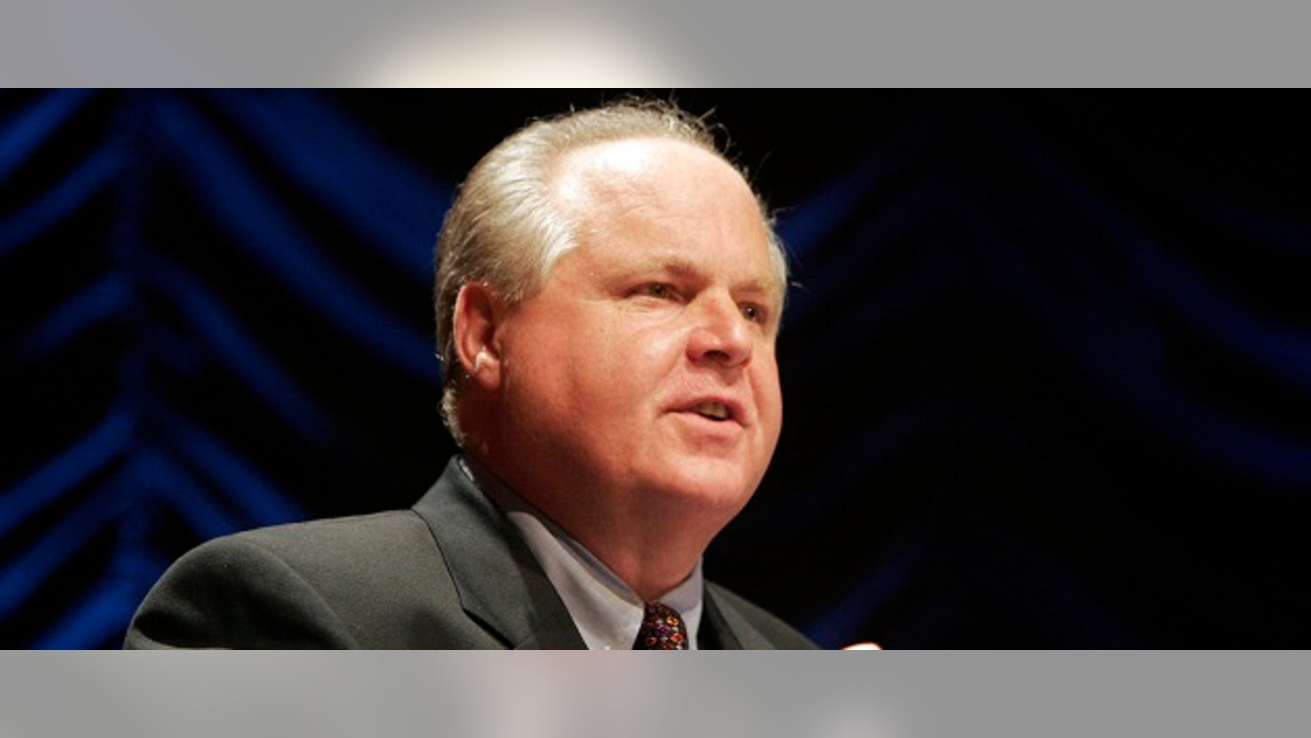 Radio show host Rush Limbaugh speaks at a forum hosted by the Heritage Foundation, on the similarities between the war on terrorism and the television show "24," in Washington June 23, 2006. REUTERS/Micah Walter (UNITED STATES) - RTR1ESGV