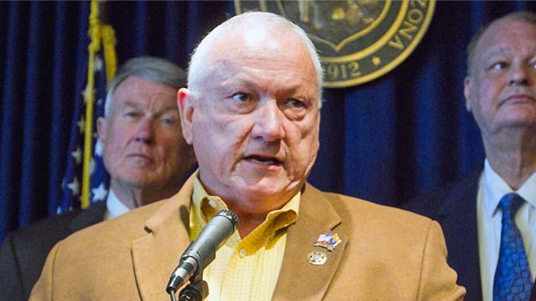 FILE - In this May 9, 2011 photo, from left, attorney John Bouma, Sen. Russell Pearce, Attorney General Tom Horne and Gov. Jan Brewer, hold a news conference to announce the state's decision to appeal to the United States Supreme Court by July 11, a decision by a lower court that put the most controversial parts of the state's immigration enforcement law on hold, in Phoenix. Pearce notched major triumphs last year, notably enactment of a tough law against illegal immigration and then his election as Senate president. This year, things haven't gone so well. Some fellow Republican senators blocked new Pearce-backed legislation on illegal immigration, Pearce's acceptance of free trips from the Fiesta Bowl raised ethics questions, and now he faces a possible recall election. (AP Photo/The Arizona Republic, Michael Schennum)