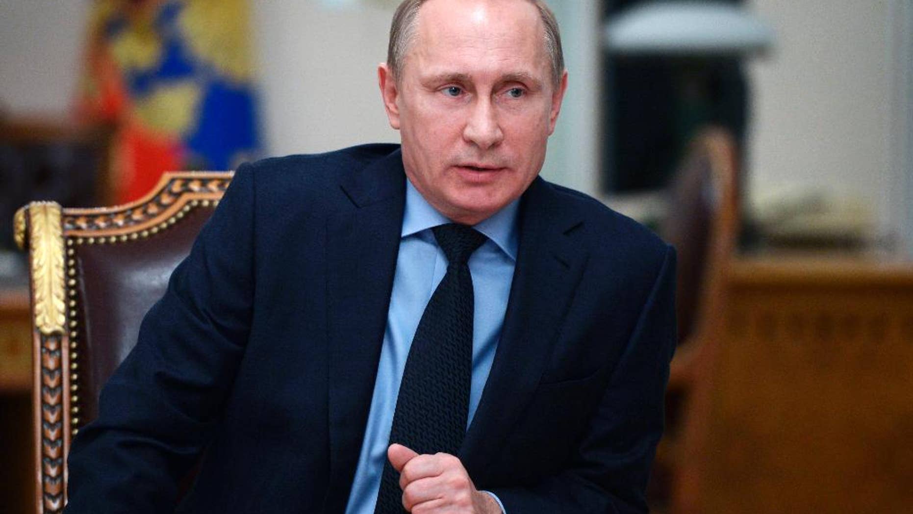 Russian President Vladimir Putin speaks during a cabinet meeting at the Novo-Ogaryovo residence outside Moscow, Russia, Monday, Jan. 26, 2015. The meeting focused on the government’s anti-crisis plan. (AP Photo/RIA-Novosti, Alexei Nikolsky, Presidential Press Service)