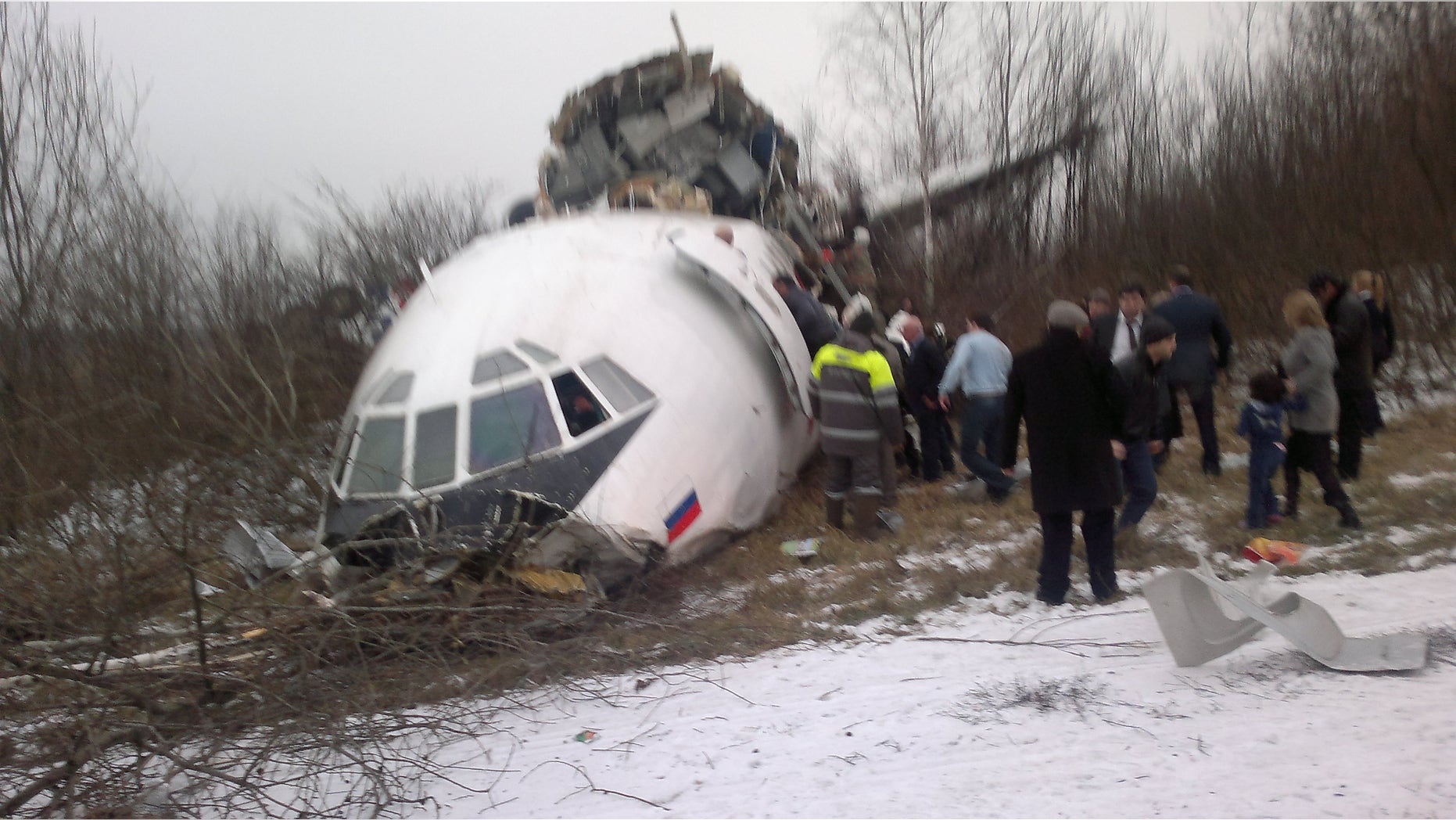 In this photo taken on a cell phone by an eyewitness, showing a Tupolev Tu-154 passenger jet belonging to Dagestan Airlines is seen after an emergency landing on Saturday, Dec. 4, 2010, at Moscow Domodedovo aiport. The passenger jet with 155 people aboard skidded off the runway during an emergency landing at the Moscow airport on Saturday, killing two people and injuring some dozens of others, Russian officials said, after all of its three engines failed.