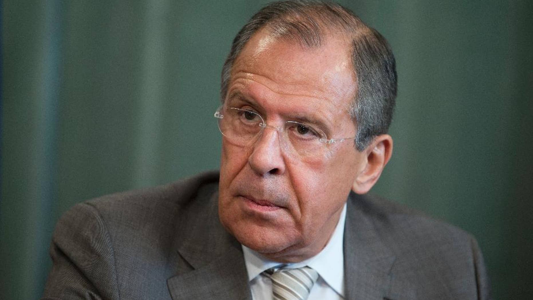 Russian Foreign Minister Sergey Lavrov attends a press conference after meeting with his South Sudanese counterpart Barnaba Benjamin at the Foreign Ministry mansion in Moscow, Russia, Monday, May 26, 2014. Sergey Lavrov said Russia has a positive view on Ukraine's presidential vote and is ready to deal with billionaire candy tycoon Petro Poroshenko, who holds a commanding lead, according to early returns. (AP Photo/Pavel Golovkin)