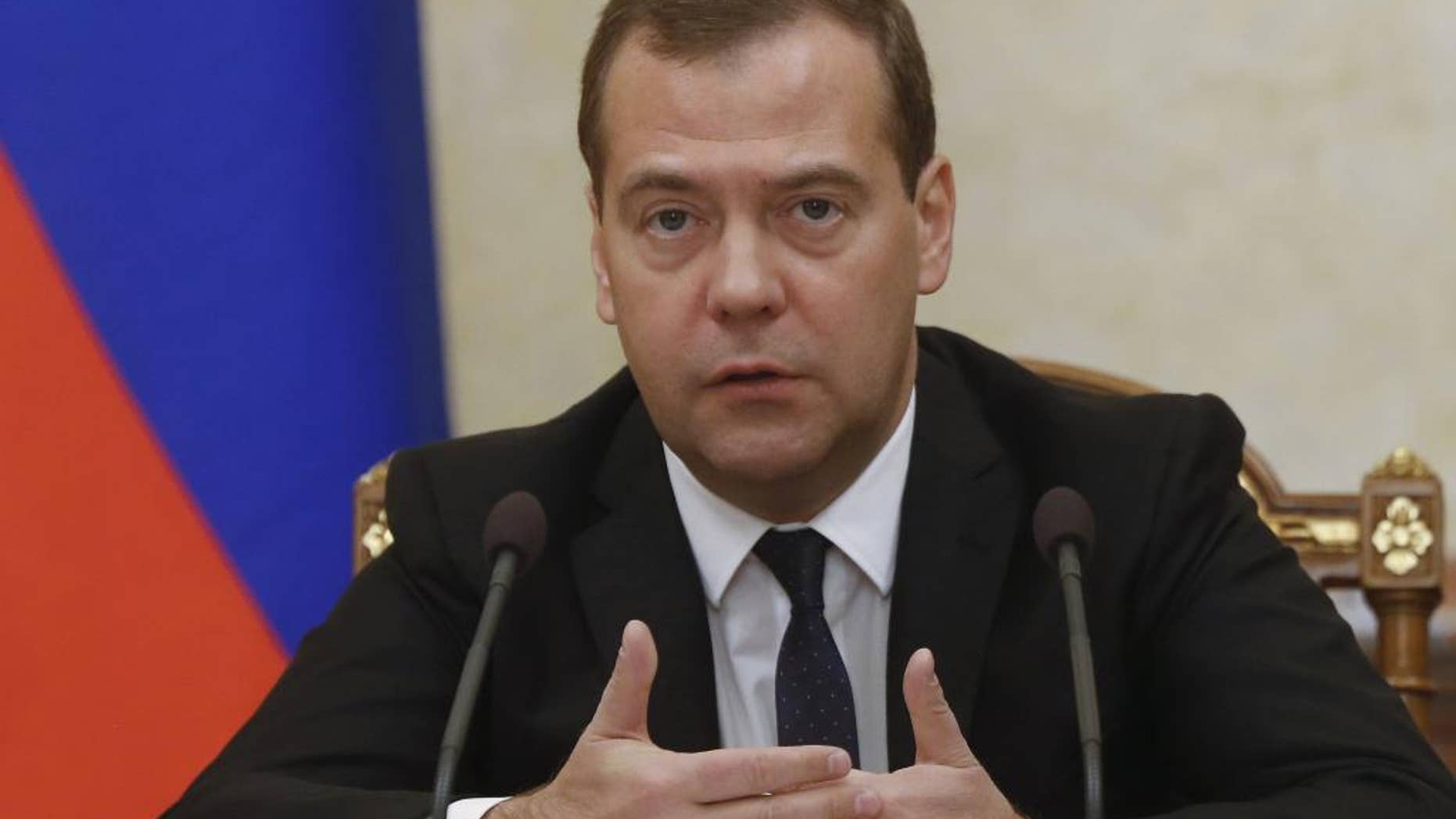 Russian Prime Minister Dmitry Medvedev heads the Cabinet meeting in the government headquarters in Moscow, Russia, Thursday, Sept. 18, 2014. (AP Photo/RIA Novosti, Dmitry Astakhov, Government Press Service)
