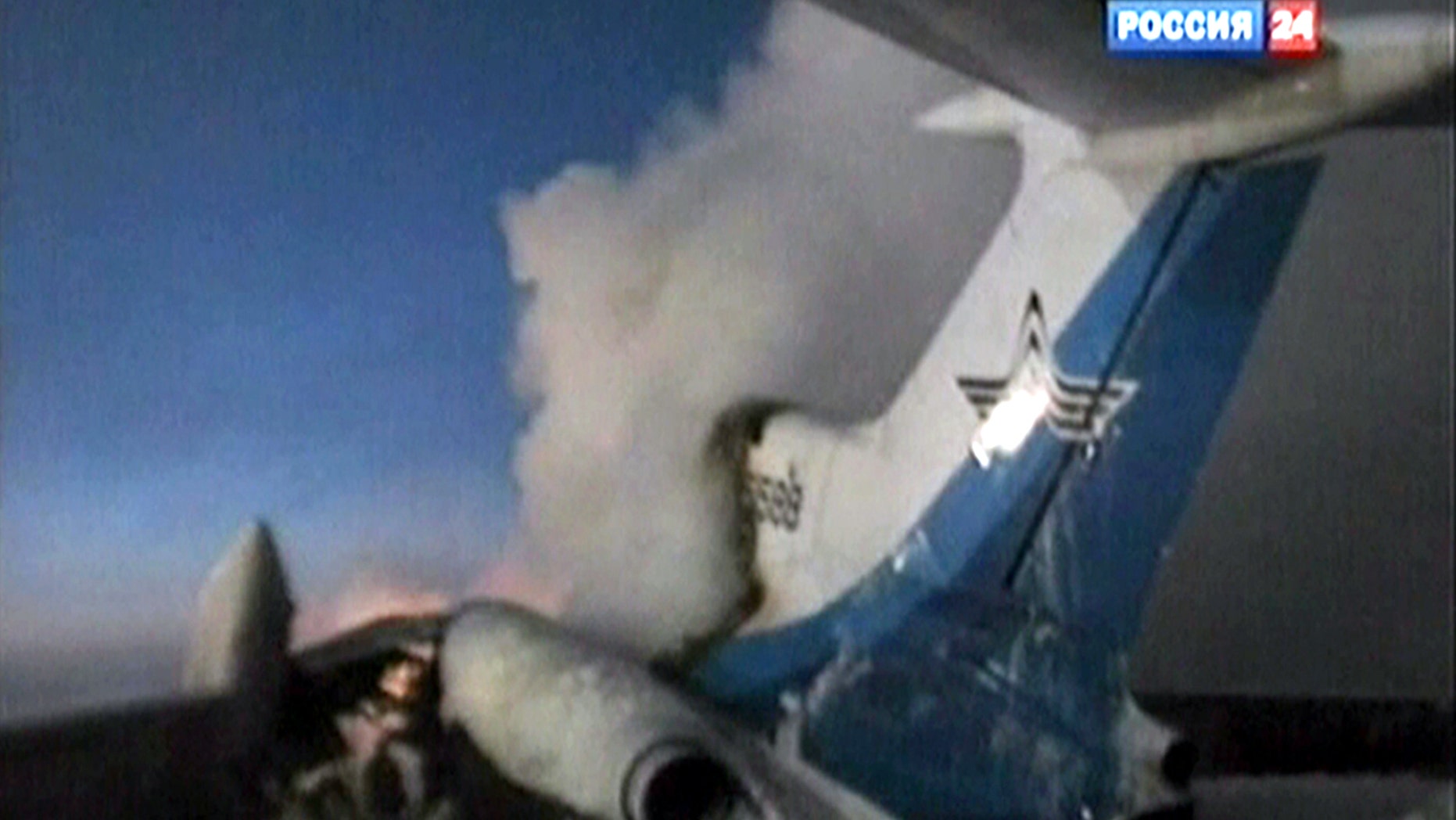 In this image taken from Russia 24 television channel TV, showing a tail part of the Russian passenger Tu-154 aircraft seen after an explosion in Surgut, about 1,350 miles east of Moscow, Russia, Saturday, Jan. 1, 2011.