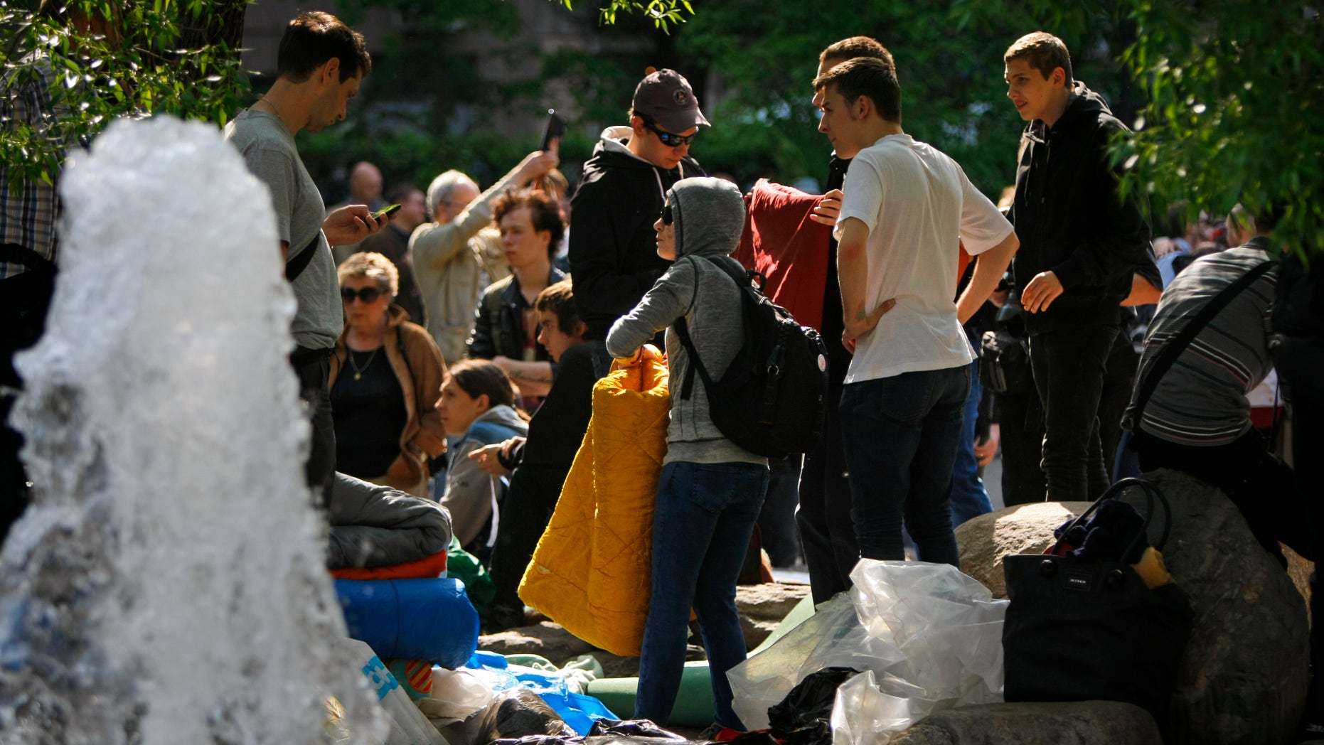 May 15, 2012: Russian youth opposition protesters gather near the monument of Kazakh poet Abai Kunanbaev, top right, in the opposition camp at the Chistiye Prudy, or Clean Ponds, where they vowed to continue the roving protest in Moscow, Russia.