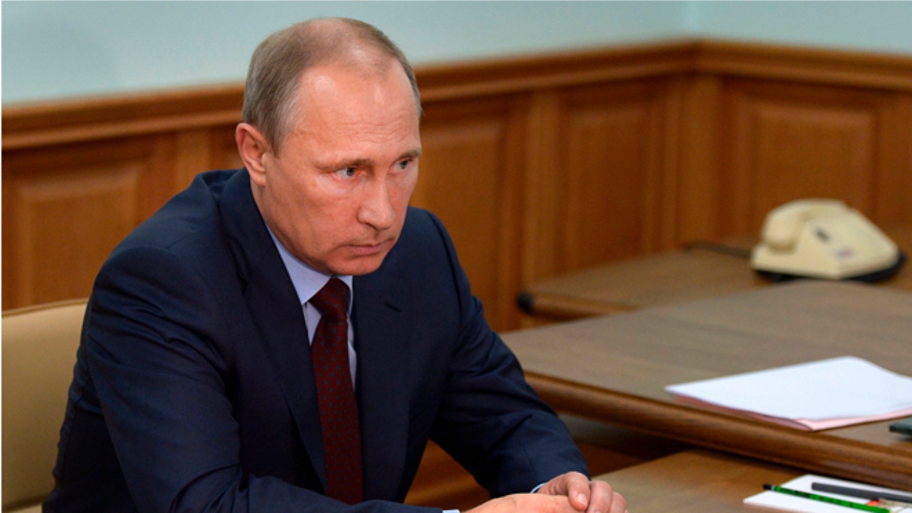 In this Friday, Sept. 5 photo, Russian President Vladimir Putin meets with Altai region acting governor in the city of Gorno-Altaisk, Siberia, Russia.