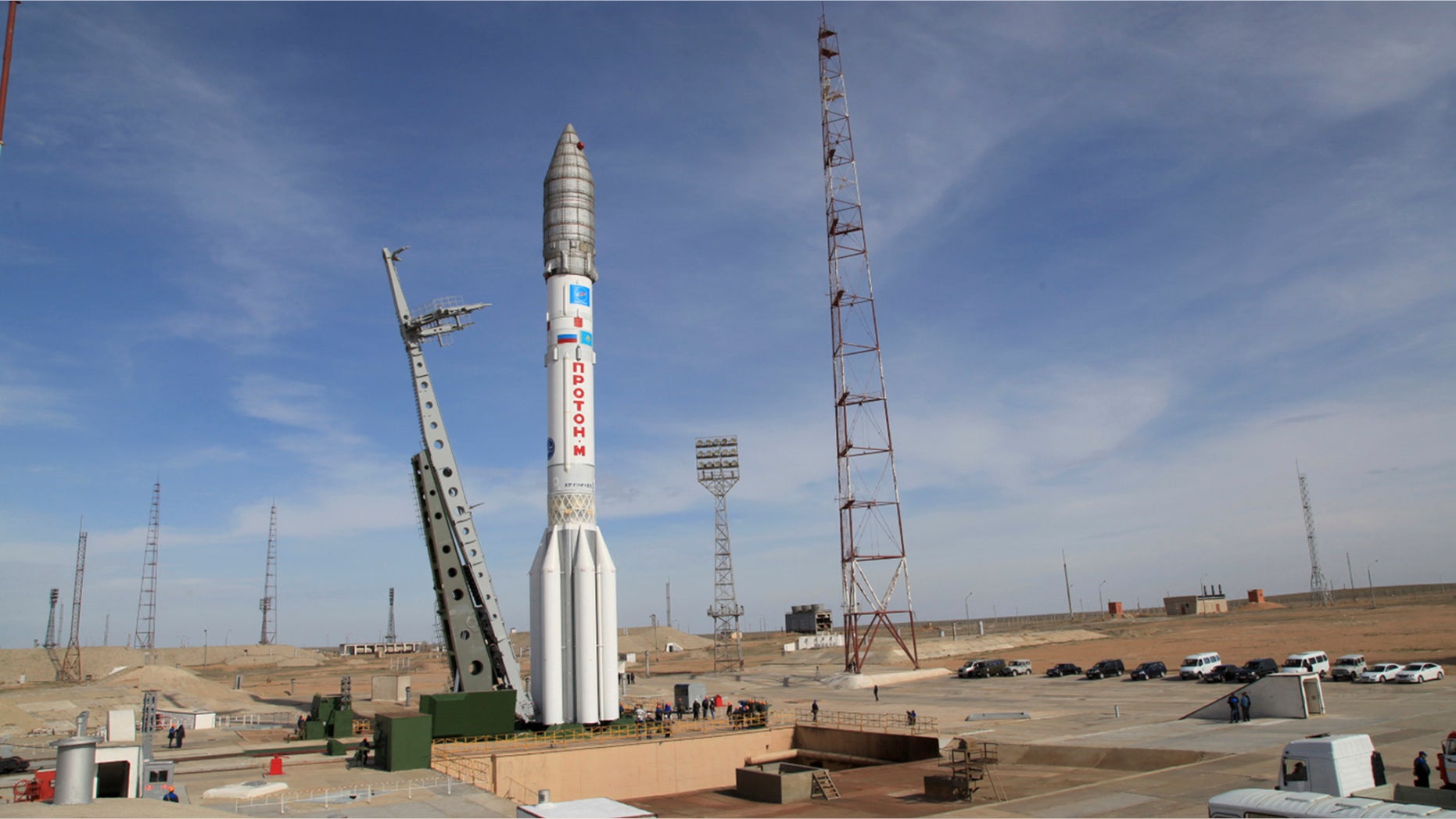 In this photo taken Thursday, April 24, 2014, a Proton-M rocket is installed at launched Baikonur launch pad in Kazakhstan. A Russian rocket, Proton-M, carrying a Mexican satellite malfunctioned Saturday May 16, 2015, shortly after its launch, the latest mishap to hit Russia's troubled space industry, whose Soviet-era glory has been tarnished by a series of launch failures. (Roscosmos via AP)