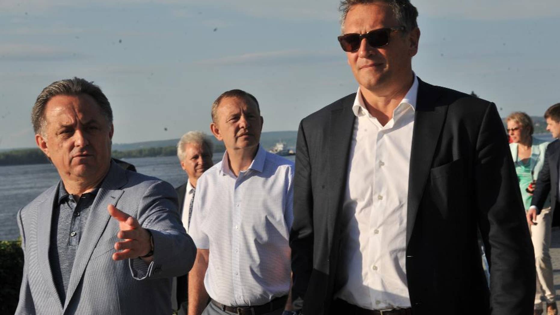June 9, 2015: FIFA Secretary General Jerome Valcke, right, and Russian Sports Minister Vitaly Mutko, left, walk along an embankment of Volga river in Samara, Russia. Valcke came to attend a 2018 World Cup board meeting.