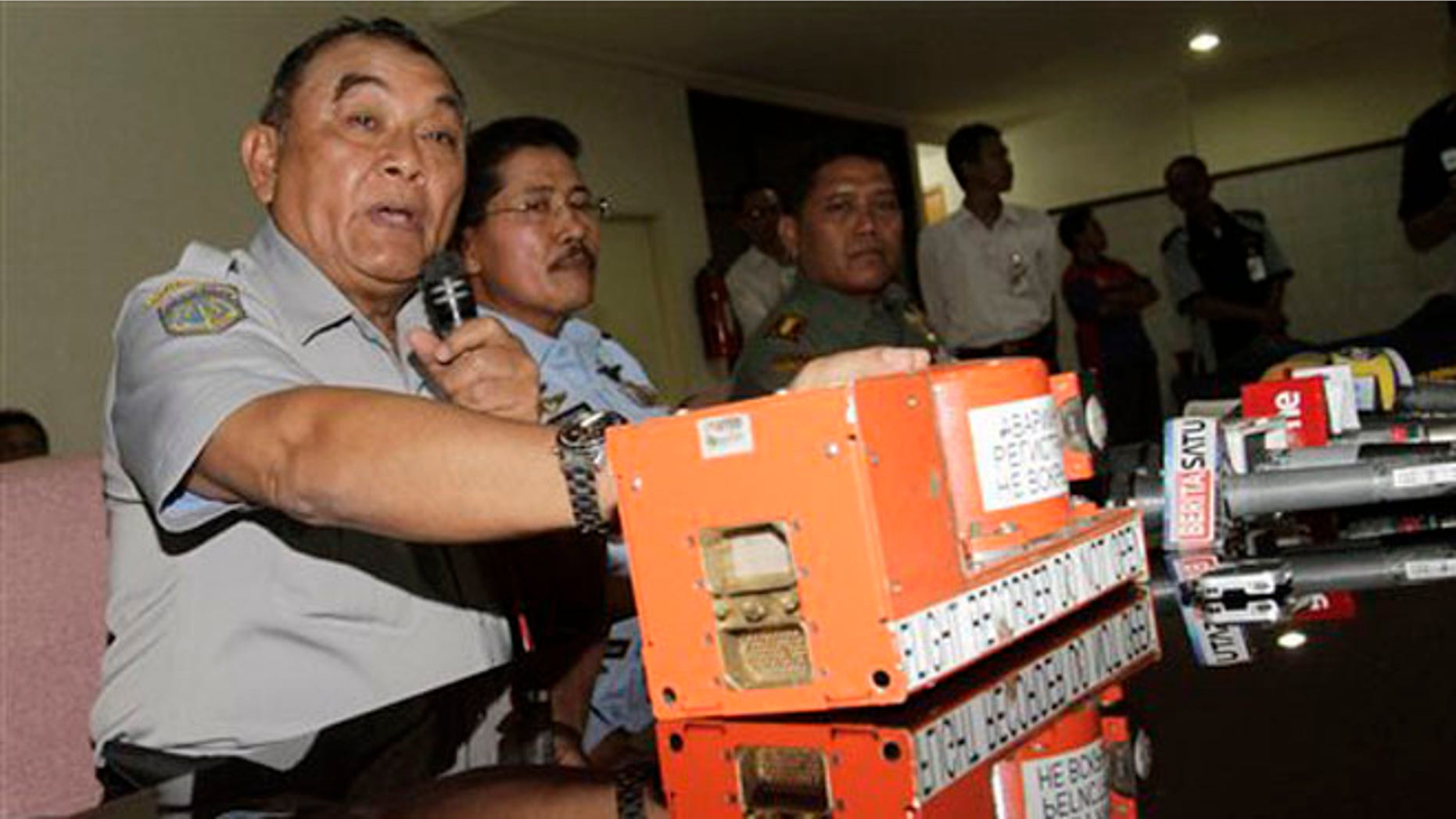 May 31, 2012: Indonesian National Transportation Safety Board chief Tatang Kurniadi with the flight data recorder of the crashed Sukhoi Superjet 100 speaks during a press conference in Jakarta, Indonesia.