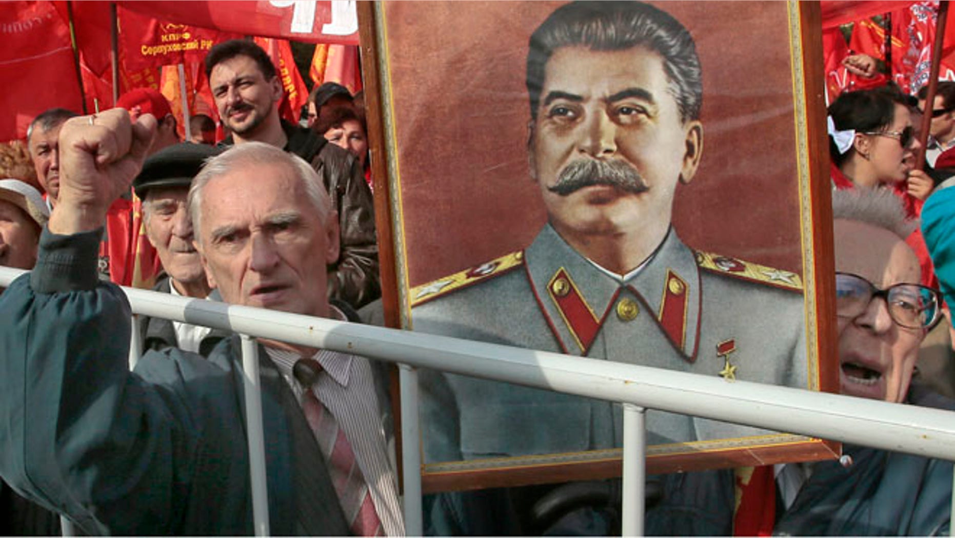 Sept. 22, 2012: Russian Communist Party supporters hold a portrait of former Soviet dictator Josef Stalin at a gathering in Moscow to protest increasing prices for communal services.