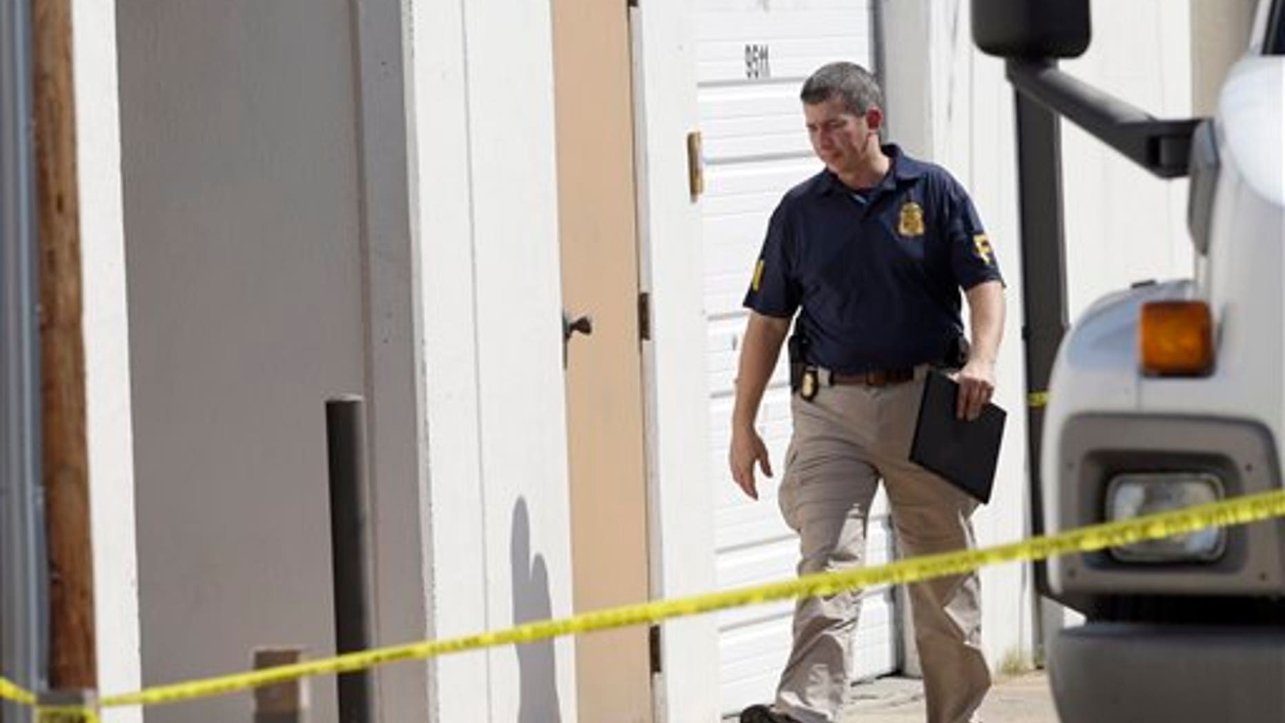 Oct. 3, 2012: An FBI agent enters Arc Electronics Inc. in Houston.