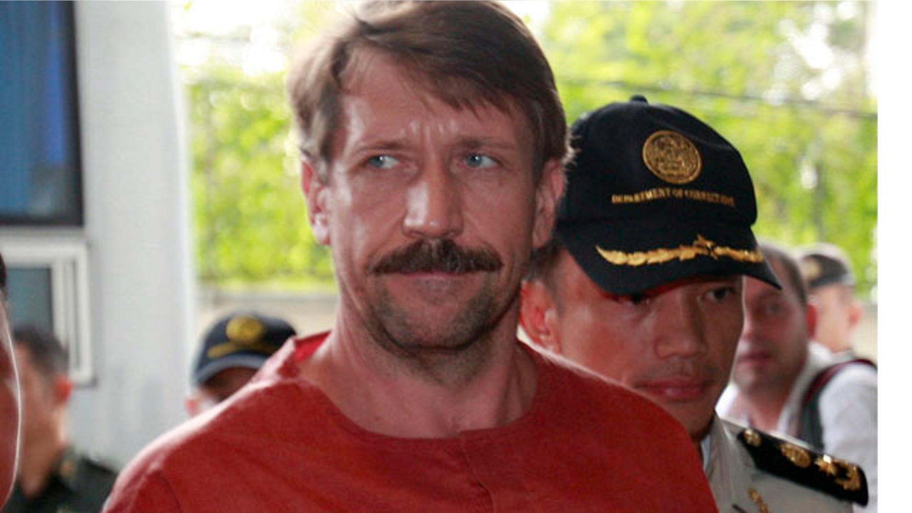 August 20: Suspected Russian arms dealer Viktor Bout, is escorted by prison officials as he arrives at the criminal court in Bangkok, Thailand.(AP)