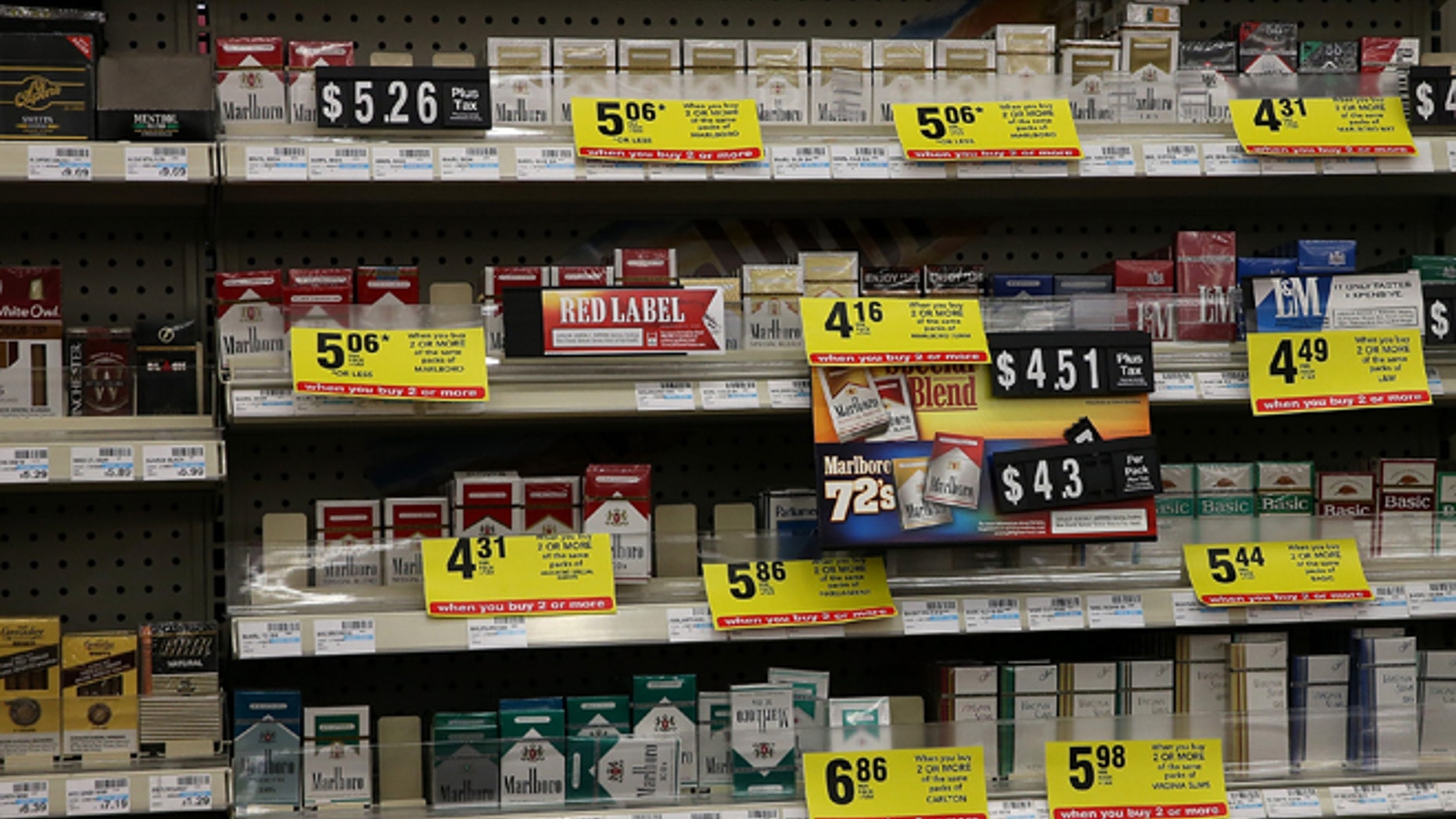 GREENBRAE, CA - FEBRUARY 06: Packs of cigarettes are displayed on a shelf at a CVS store on February 6, 2014 in Greenbrae, California. CVS Caremark announced Wednesday that it will no longer sell cigarettes or other tobacco products as of October 1, 2014 at its CVS/pharmacy stores. (Photo by Justin Sullivan/Getty Images)