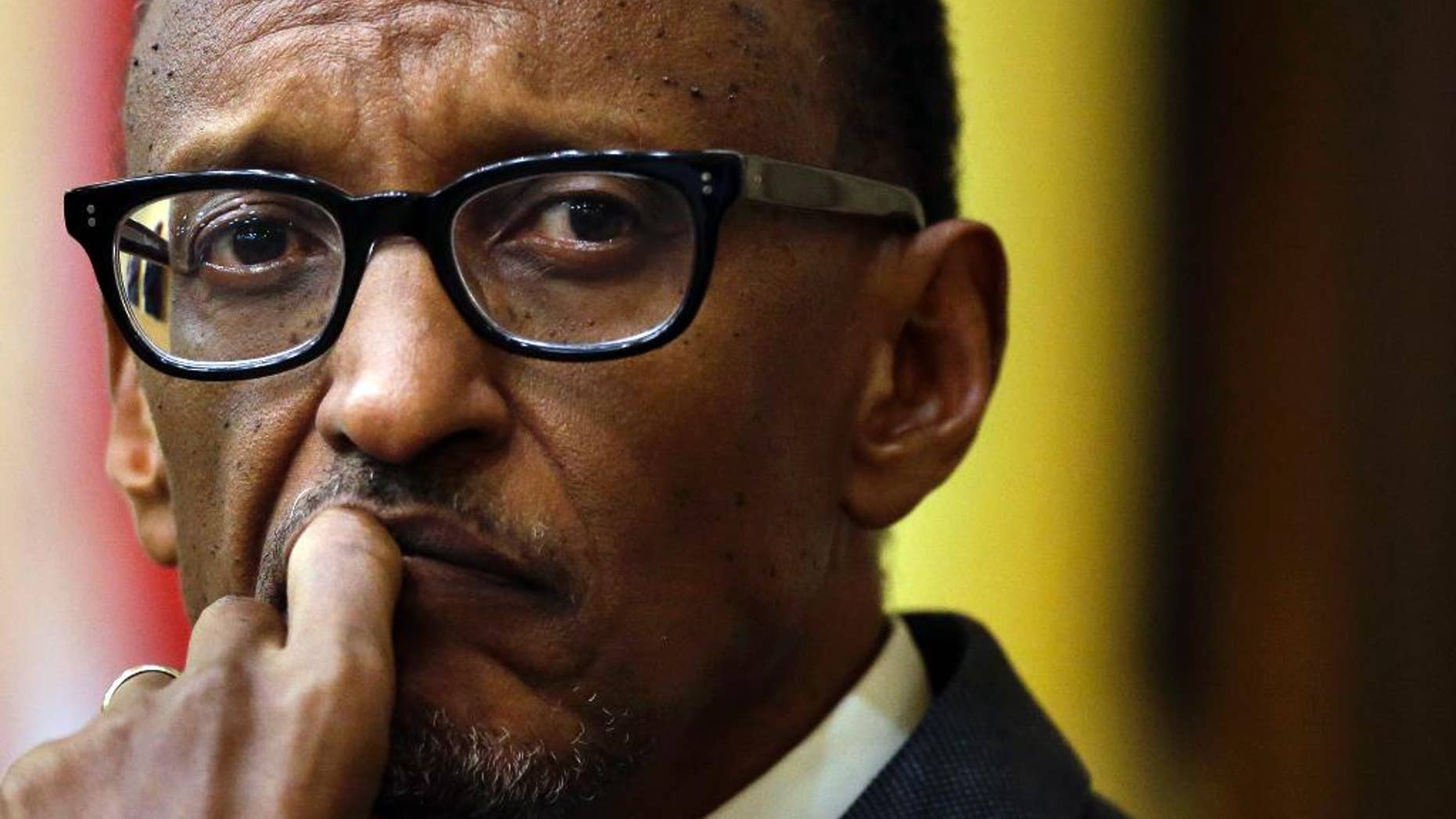 Rwandan President Paul Kagame listens to a question while participating in a panel discussion on the campus of Tufts University, Tuesday, April 22, 2014, in Medford, Mass. Kagame addresses an audience Tuesday on issues relating to the 20th anniversary of the genocide of the Tutsis. (AP Photo/Steven Senne)