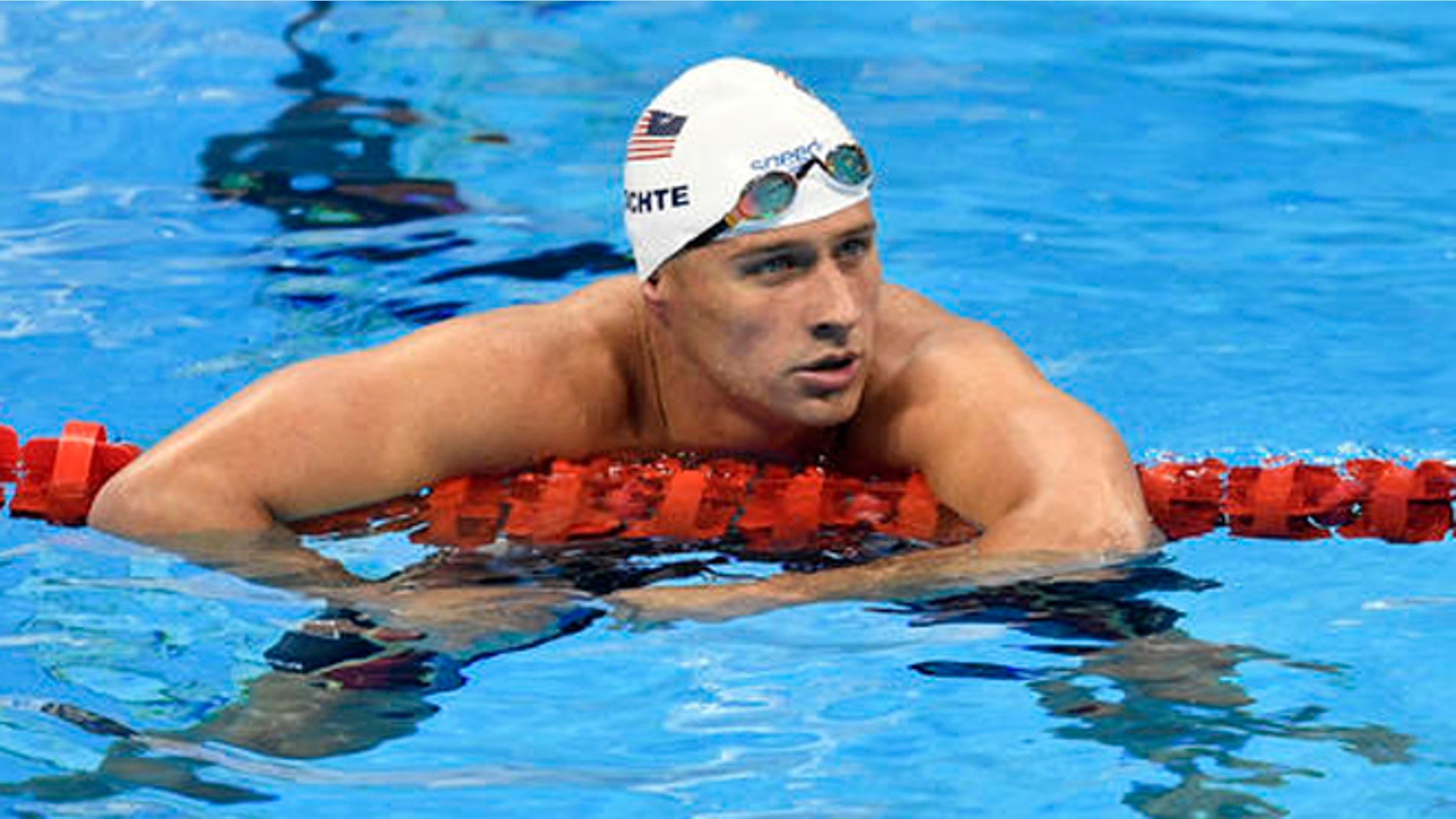 FILE - In this Aug. 9, 2016, file photo, United States' Ryan Lochte checks his time after a men' 4x200-meter freestyle relay heat during the swimming competitions at the 2016 Summer Olympics in Rio de Janeiro, Brazil. A Brazilian police official told The Associated Press that Lochte fabricated a story about being robbed at gunpoint in Rio de Janeiro. (AP Photo/Martin Meissner, File)