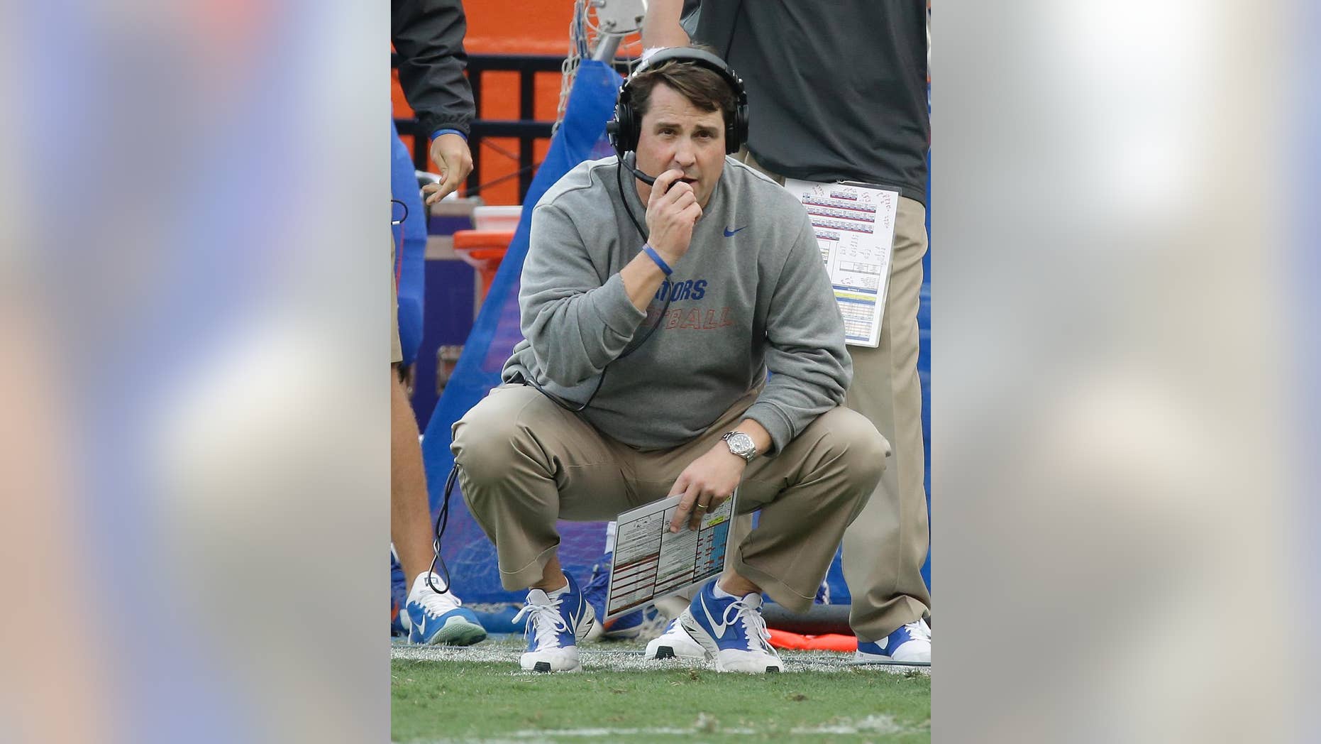 Florida head coach Will Muschamp watches from the sideline as South Carolina is about to score a touchdown to tie the game and send it in to overtime late in the second half of an NCAA college football game in Gainesville, Fla., Saturday, Nov. 15, 2014. South Carolina won in overtime 23-20. (AP Photo/John Raoux)