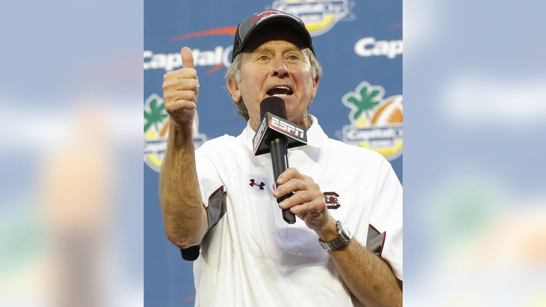FILE - This Jan. 1, 2014, file photo shows South Carolina head coach Steve Spurrier thanking fans for their support after winning 34-24 in the Capital One Bowl NCAA college football game against Wisconsin in Orlando, Fla. Spurrier thinks South Carolina still has plenty of good players, maybe even good enough to win the head ball coach what he covets most _ a Southeastern Conference championship. (AP Photo/John Raoux, File)