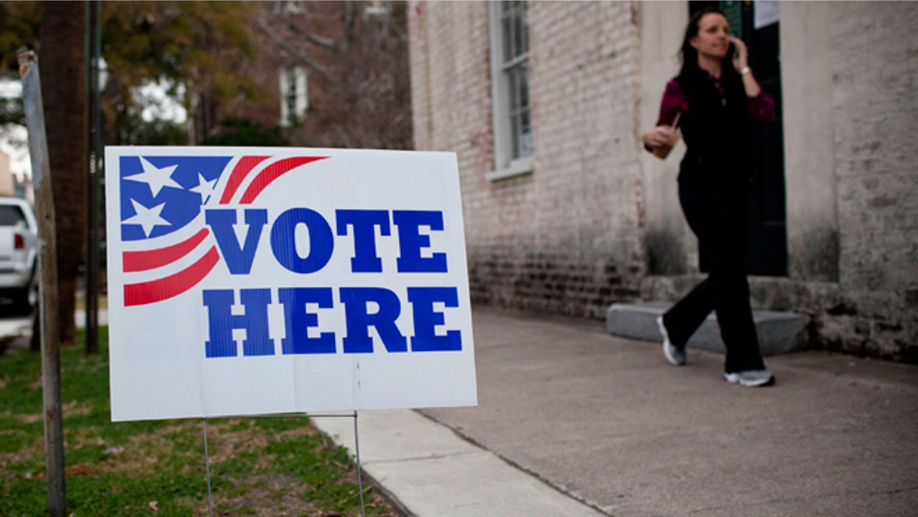 CHARLESTON, SC - JANUARY 21: A "Vote Here" sign is seen outside an East Bay Street voting station on January 21, 2012 in Charleston, South Carolina. Voters decided between four major candidates in the key conservative state. (Photo by Andrew Burton/Getty Images)