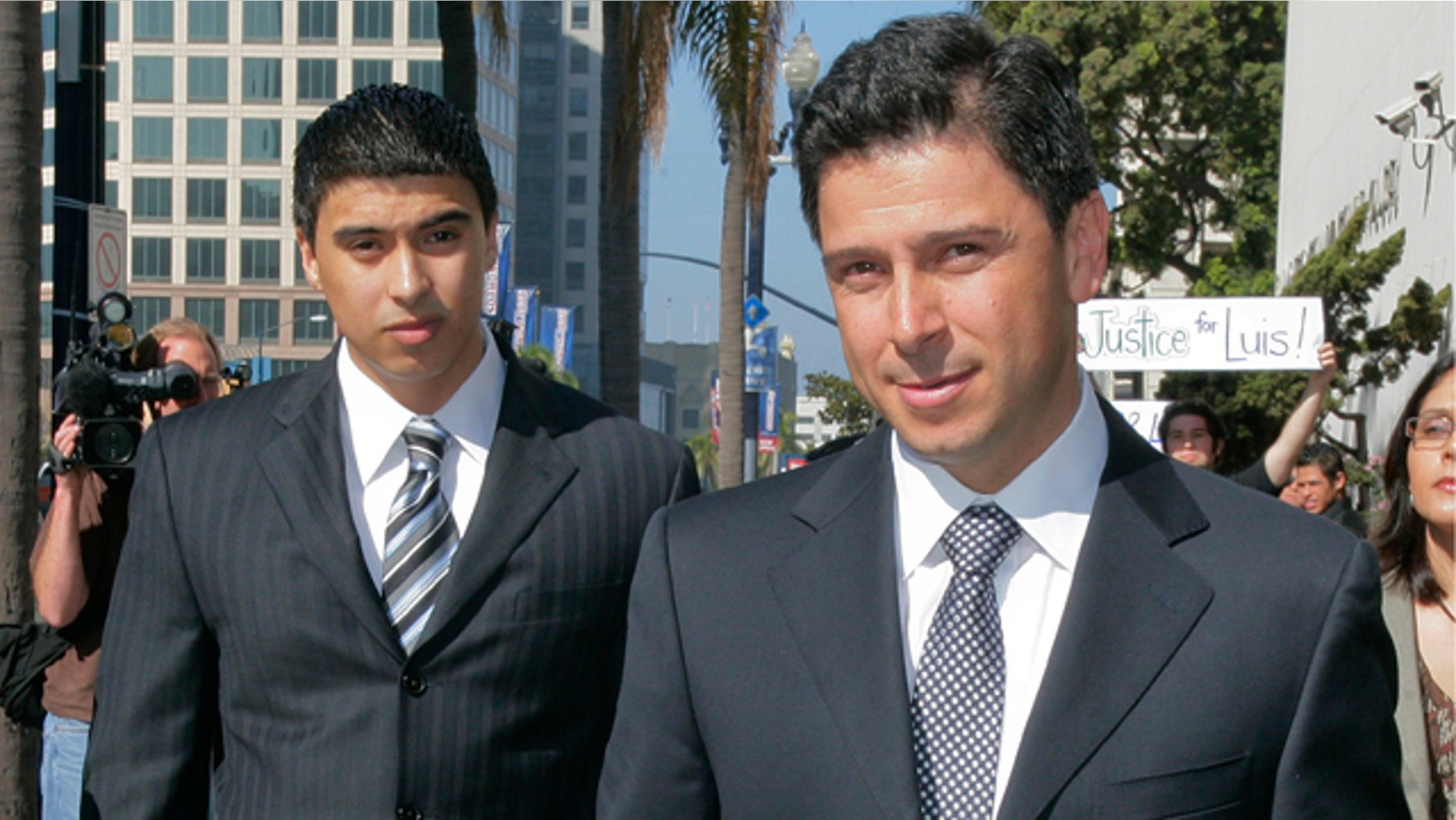 Former California Assembly Speaker Fabian Nunez, right, and his son Esteban Nunez, left, leave a hearing in Superior Court in San Diego