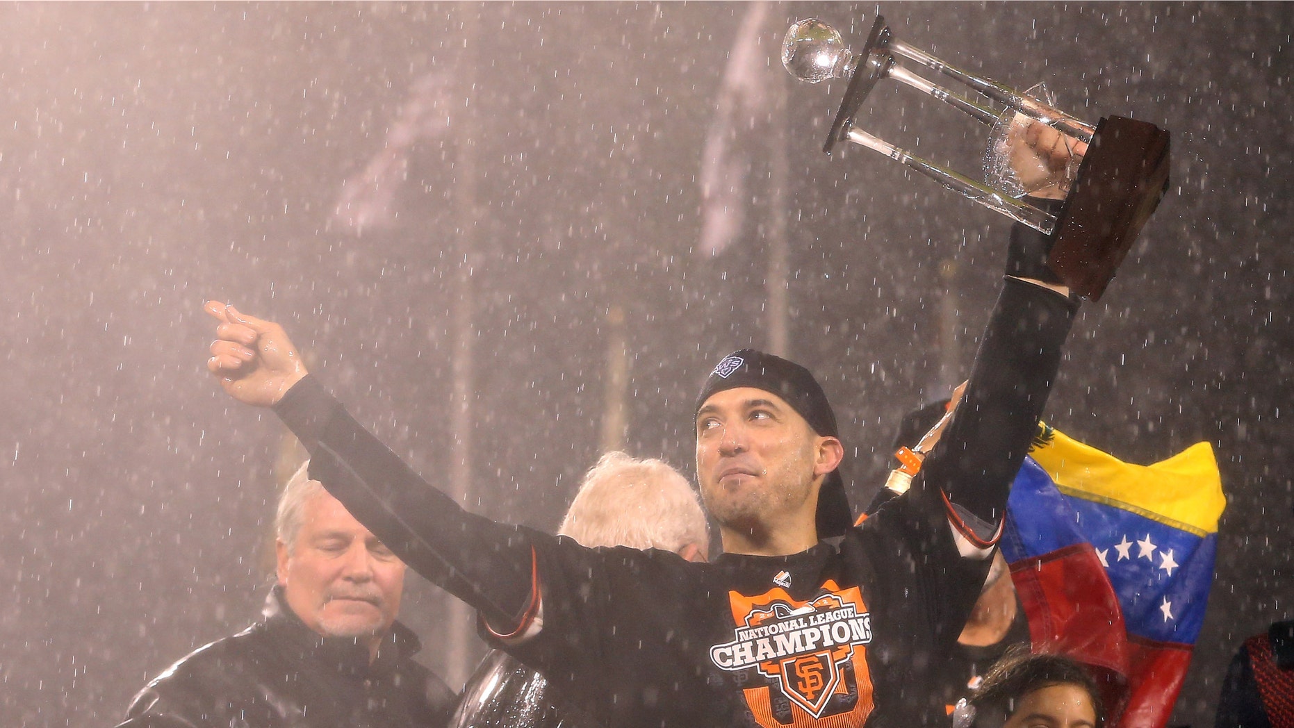 SAN FRANCISCO, CA - OCTOBER 22: Marco Scutaro #19 of the San Francisco Giants holds up the MVP trophy after the Giants defeat the St. Louis Cardinals 9-0 in Game Seven of the National League Championship Series at AT&T Park on October 22, 2012 in San Francisco, California. (Photo by Christian Petersen/Getty Images)
