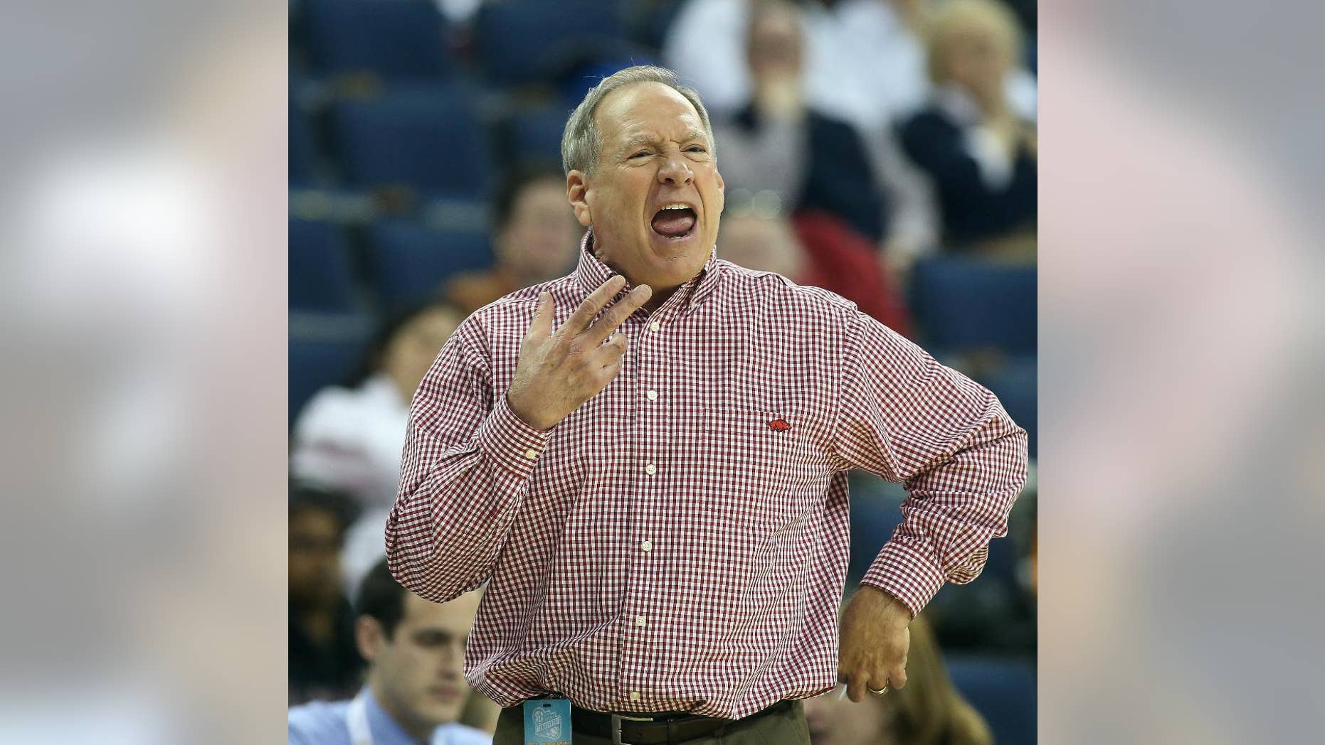 Arkansas head coach Tom Collen yells to his players in the first half of a first-round women's Southeastern Conference tournament NCAA college basketball game against the Mississippi Wednesday, March 5, 2014, in Duluth, Ga. (AP Photo/Jason Getz)