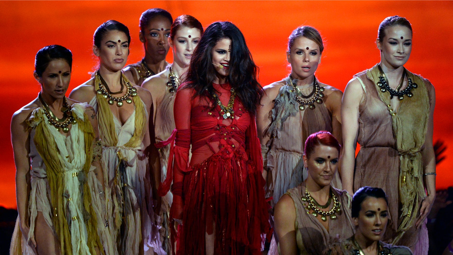CULVER CITY, CA - APRIL 14: Actress-singer Selena Gomez (C) performs onstage during the 2013 MTV Movie Awards at Sony Pictures Studios on April 14, 2013 in Culver City, California. (Photo by Kevork Djansezian/Getty Images)