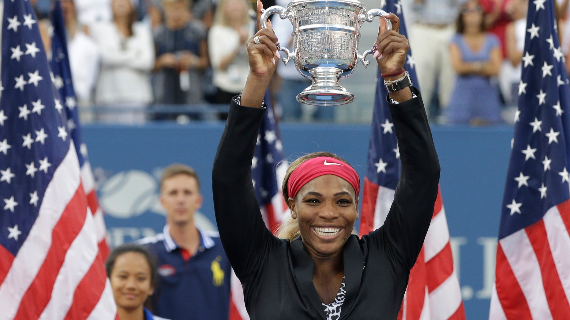 Sept. 7, 2014: Serena Williams, of the United States, holds up the championship trophy after defeating Caroline Wozniacki, of Denmark, during the championship match of the 2014 U.S. Open tennis tournament.