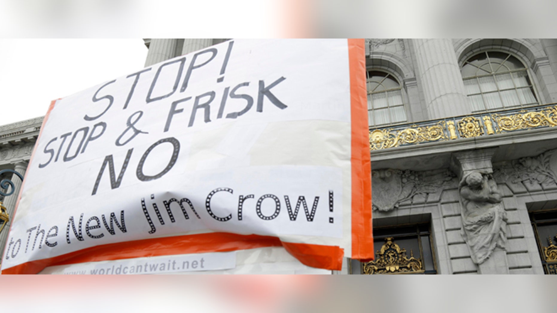 FILE - In this July 17, 2012 file photo, a rally in opposition to stop and frisk proposal takes place outside of city hall in San Francisco. San Francisco mayor Ed Lee has abandoned a police stop and frisk proposal designed to get weapons off the streets. The mayor now says he will instead rely on targeted police enforcement, crime-tracking software and increased involvement by ministers to combat the gun violence. Lee is announcing details of his alternative plan on Tuesday at a local church. (AP Photo/Marcio Jose Sanchez, File)