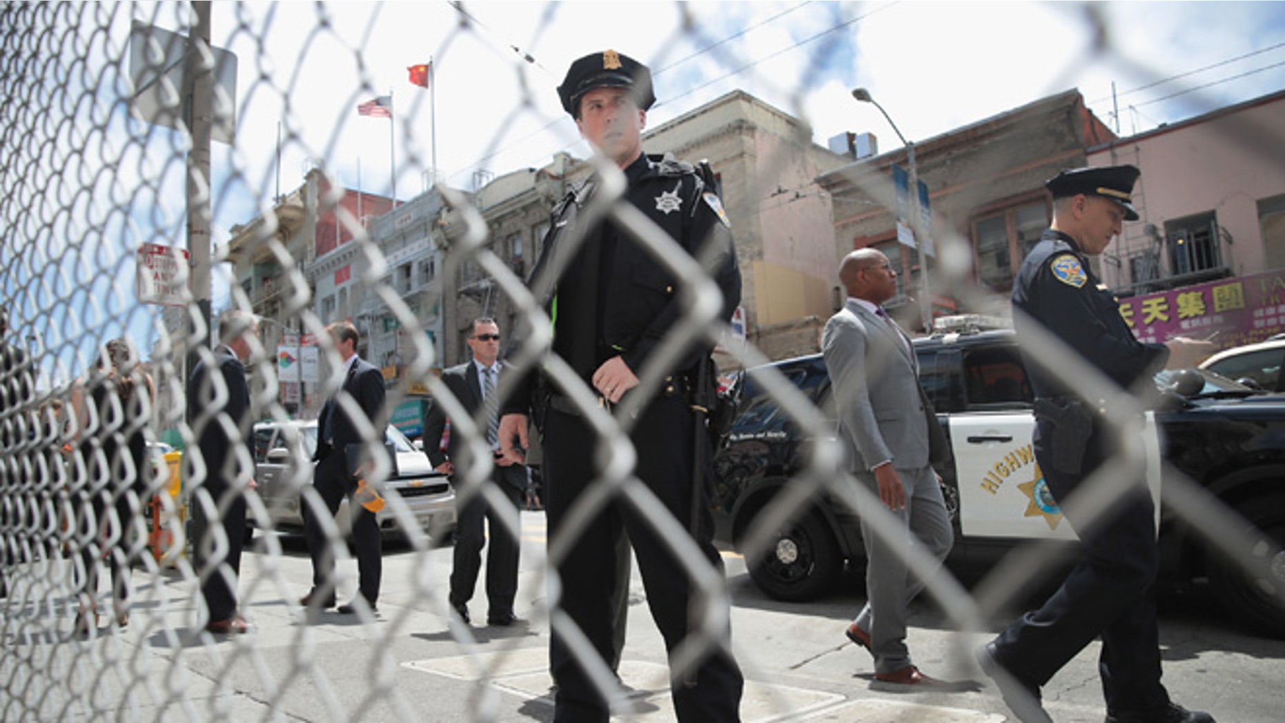 SAN FRANCISCO, CA - JUNE 06: Police keep watch as Democratic presidential candidate Senator Bernie Sanders (D-VT) campaigns in the Chinatown neighborhood on June 6, 2016 in San Francisco, California. Voters in California go to the polls tomorrow for the state's primary where most polls have Sanders and Hillary Clinton in an even race. (Photo by Scott Olson/Getty Images)