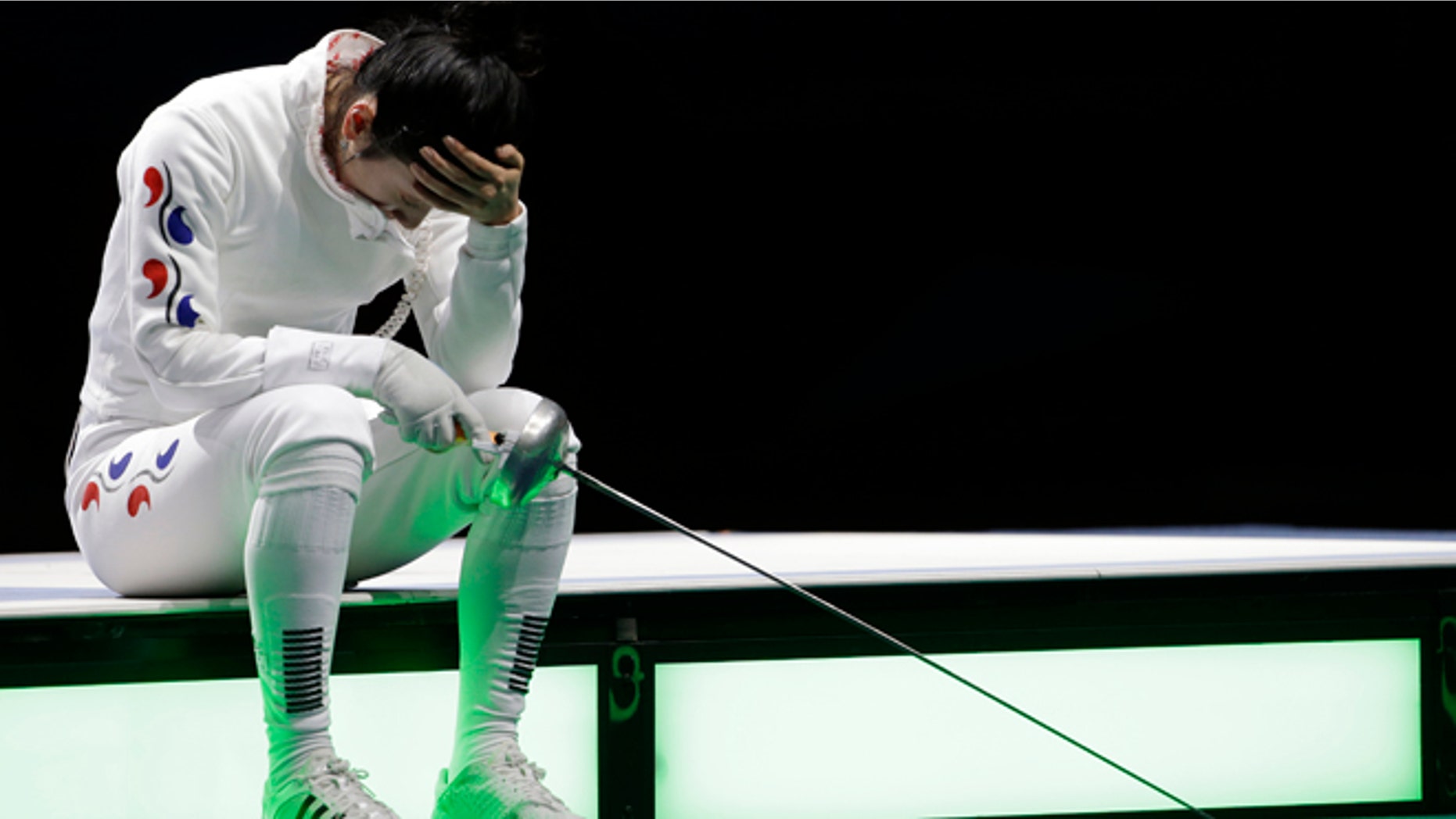 July 30, 2012: South Korea's Shin A-lam waits for an appeal to an officials decision after a women's individual epee fencing semifinals match against Germany's Britta Heidemann at the 2012 Summer Olympics, in London.
