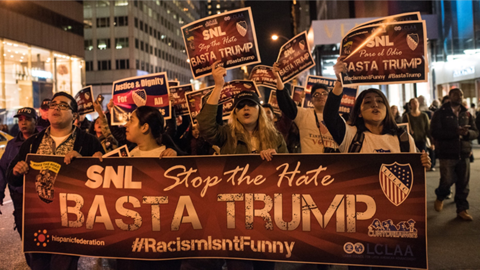 NEW YORK, NY - NOVEMBER 7: Members of Latino organizations march from the Trump Tower to NBC studios during a rally against Republican Presidential candidate Donald Trump on November 7, 2015 in New York City. Trump is set to host NBC's Saturday Night Live, and has faced criticism during the campaign for his proposed immigration policies. (Photo by Andrew Renneisen/Getty Images).