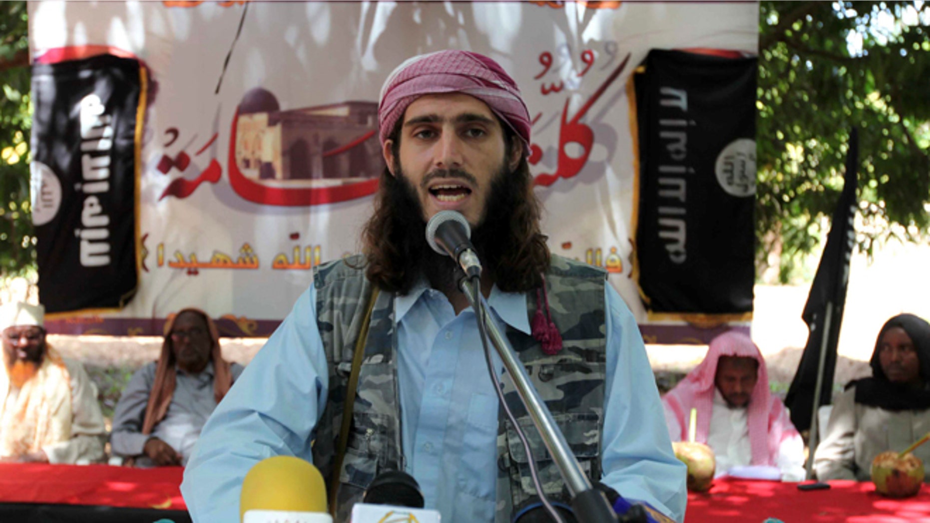 FILE 2011: American-born Islamist militant fighter, Omar Hamami, known as Abu Mansur Al-Amriki, addresses a news conference at a farm in southern Mogadishu's Afgoye district.