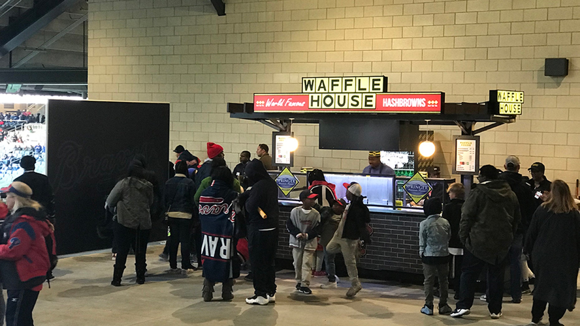 A newly-opened Waffle House stand at SunTrust Park in Atlanta, Georgia for the first time offers beer to fans of the famed restaurant chain.