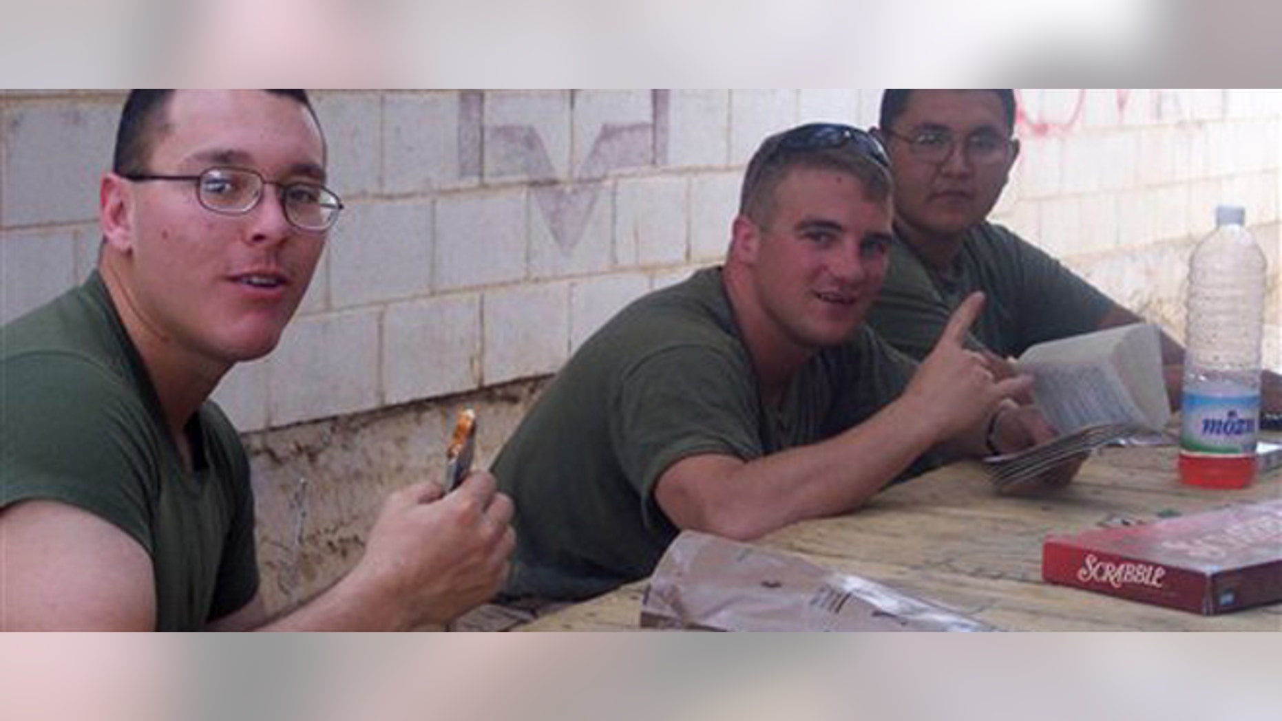 This 2005 photo provided by Marine William J. Moore, shows fellow Marine José Guerena Ortiz, left, while deployed at Camp Korean Village FOB with Marine Wing Support Squadron 371.