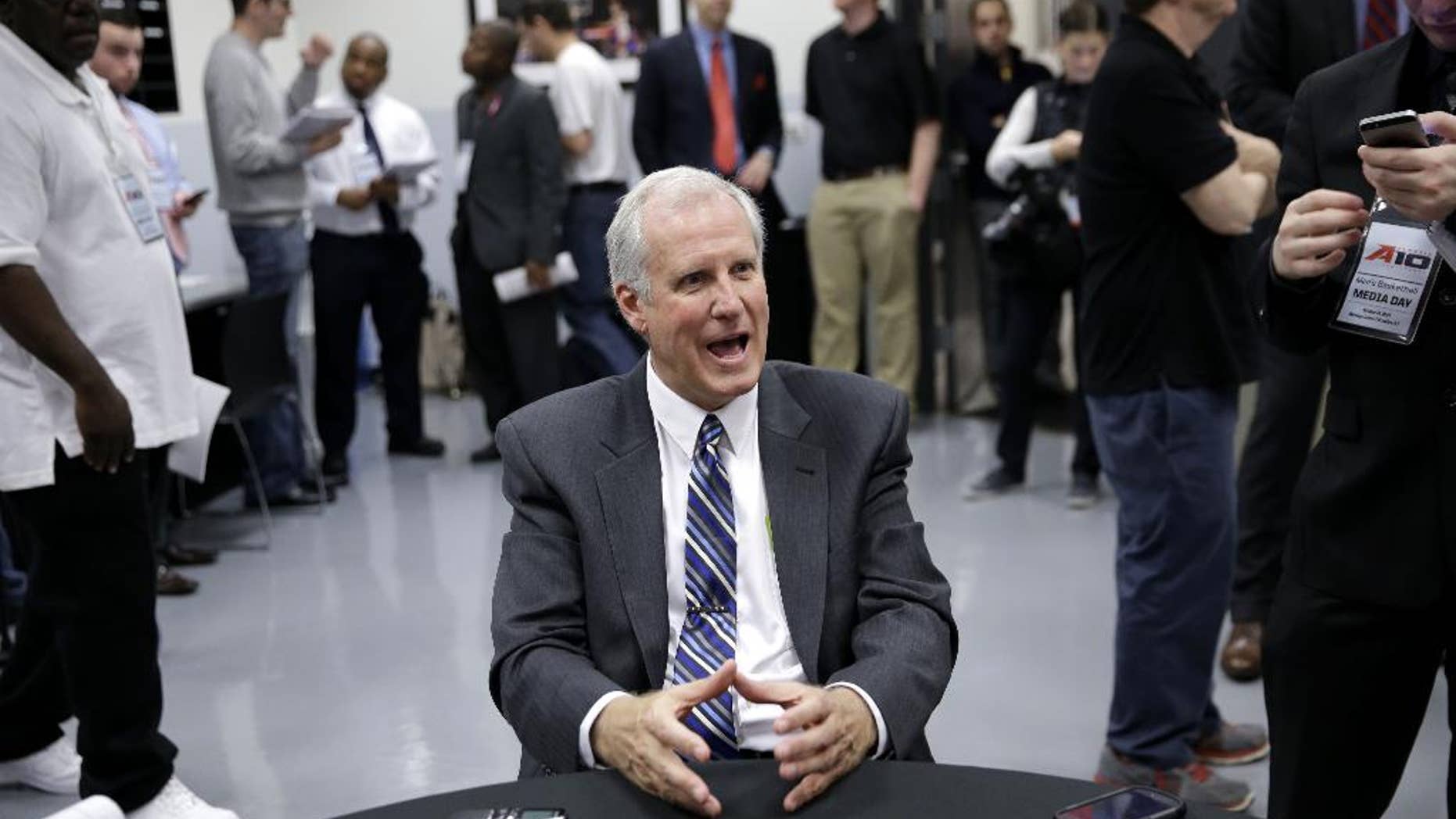 FILE - In this Oct. 14, 2014, file photo, Saint Louis men's NCAA college basketball head coach Jim Crews talks to reporters during the Atlantic 10 media day in New York. Saint Louis has been to the NCAA tournament a school-record three straight seasons, but a fourth will be tough with five new starters. (AP Photo/Seth Wenig, File)