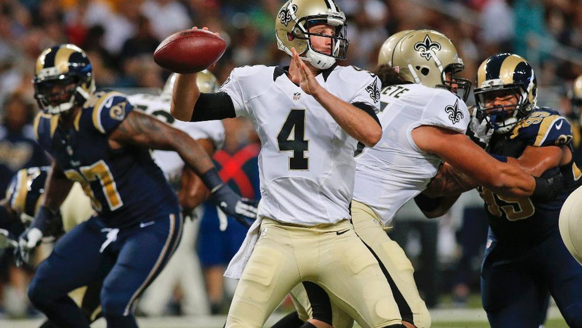 New Orleans Saints quarterback Ryan Griffin (4) passes against the St. Louis Rams during the first quarter of a preseason NFL football game Friday, Aug. 8, 2014, in St. Louis. (AP Photo/Scott Kane)