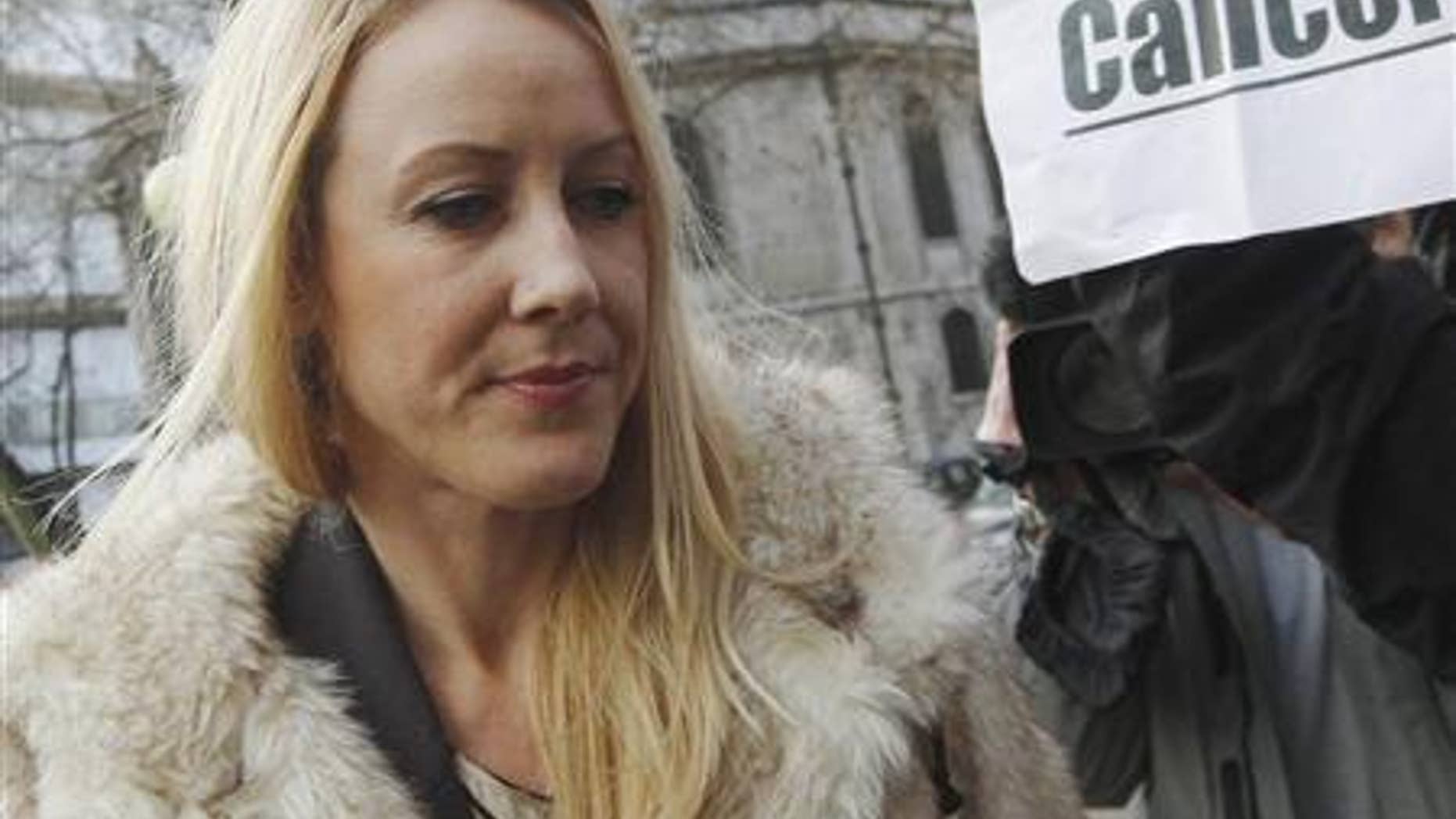 Sally Roberts, Mother of 7-year-old cancer sufferer Neon, arrives at The High Court in central London December 21, 2012. (REUTERS/Luke MacGregor)