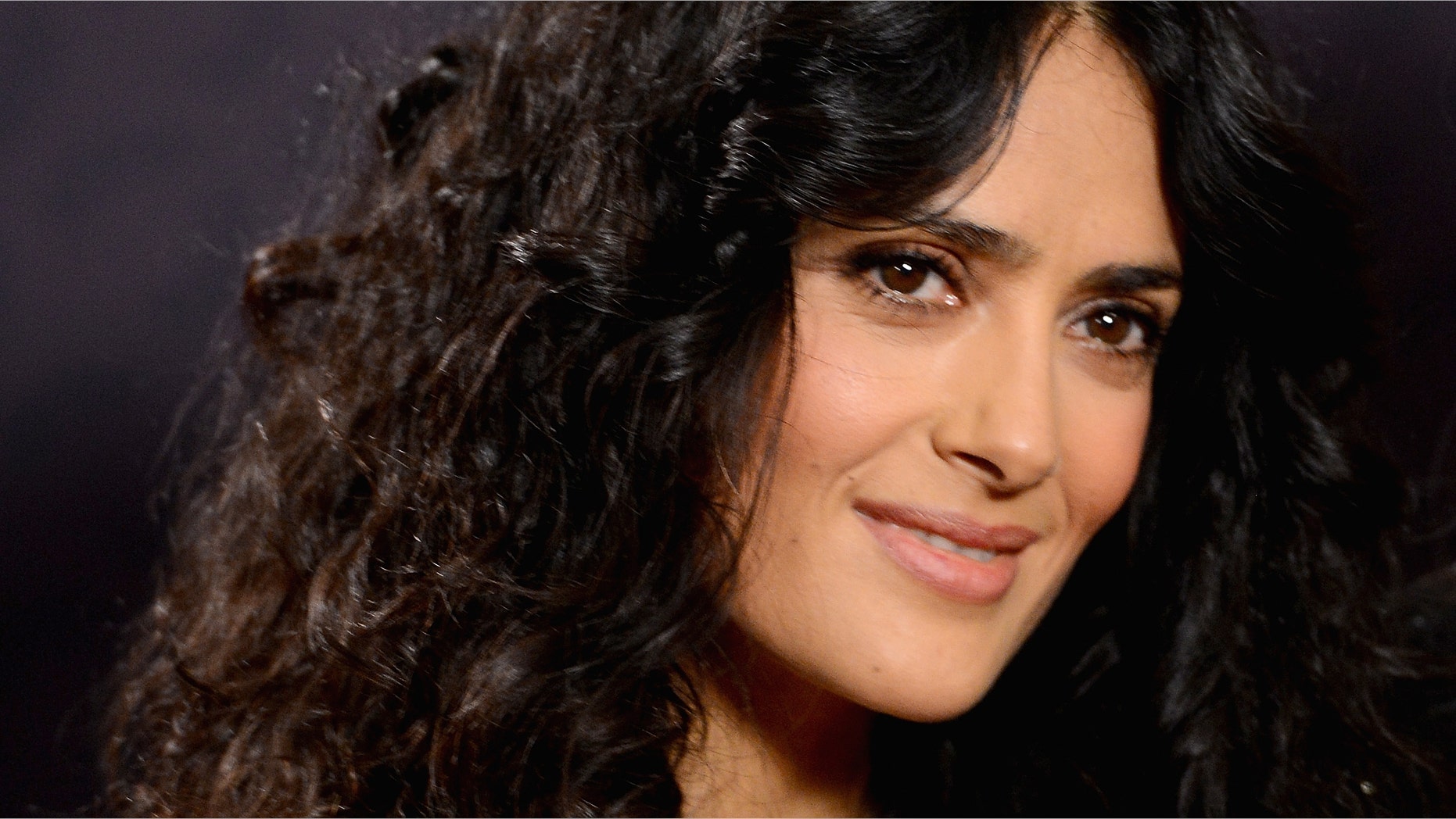 LONDON, ENGLAND - JUNE 01: Co-founder Salma Hayek Pinault poses backstage in the media room at the "Chime For Change: The Sound Of Change Live" Concert at Twickenham Stadium on June 1, 2013 in London, England. Chime For Change is a global campaign for girls' and women's empowerment founded by Gucci with a founding committee comprised of Gucci Creative Director Frida Giannini, Salma Hayek Pinault and Beyonce Knowles-Carter. (Photo by Ian Gavan/Getty Images for Gucci)