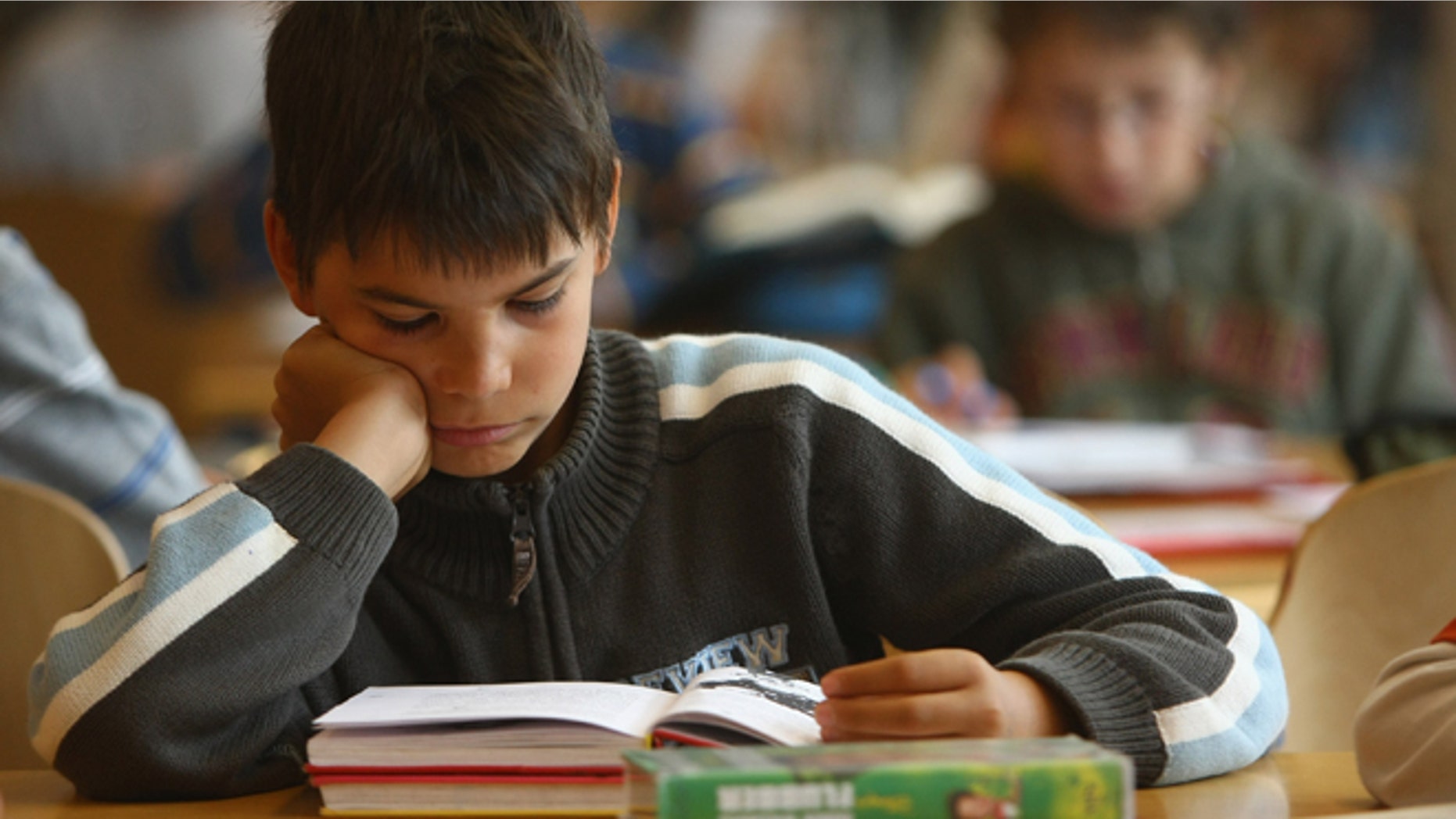 BERLIN - SEPTEMBER 18: Fourth-grade students read books in the elementary school at the John F. Kennedy Schule dual-language public school on September 18, 2008 in Berlin, Germany. The German government will host a summit on education in Germany scheduled for mid-October in Dresden. Germany has consistantly fallen behind in recent years in comparison to other European countries in the Pisa education surveys, and Education Minister Annette Schavan is pushing for an 8 percent increase in the national educaiton budget for 2009. (Photo by Sean Gallup/Getty Images)