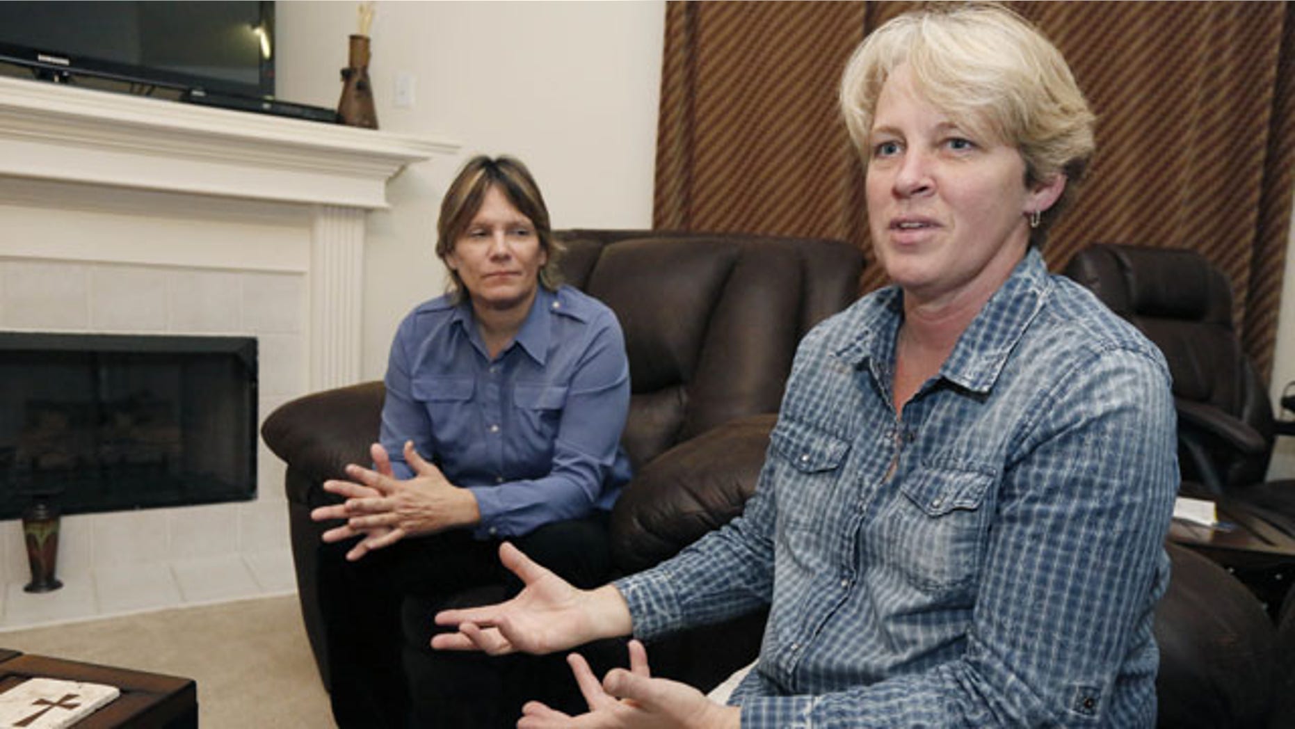 November 5, 2013: Dawn Jefferies, right, speaks in Hernando, Miss., about the efforts Lauren Czekala-Chatham, left, has taken to get the state to recognize a same sex marriage performed in California, so she can now divorce that same partner she lived with as a couple in DeSoto County, until they separated in 2010. Jefferies is Czekala-Chatham's new partner.