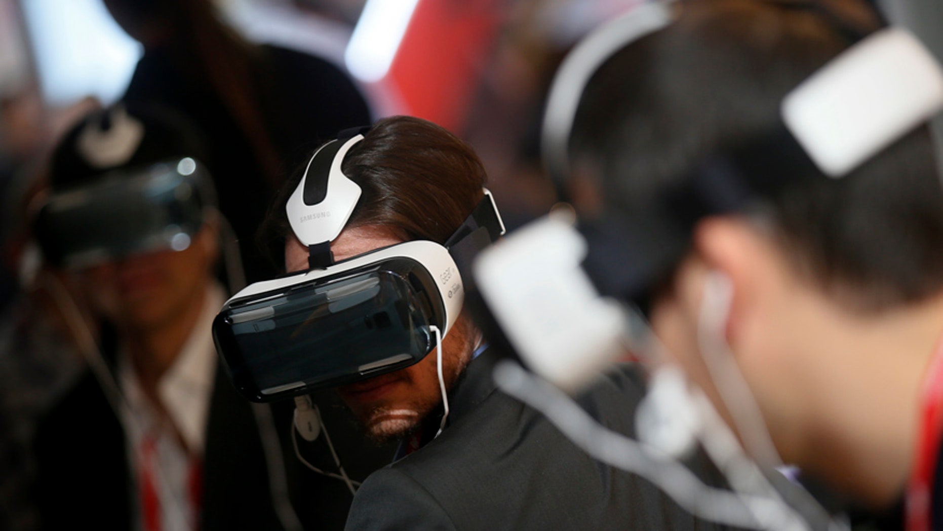 File photo. Visitors check Samsung's new virtual reality (VR) headset called the Gear VR Innovation Edition during the Mobile World Congress in Barcelona March 3, 2015.
