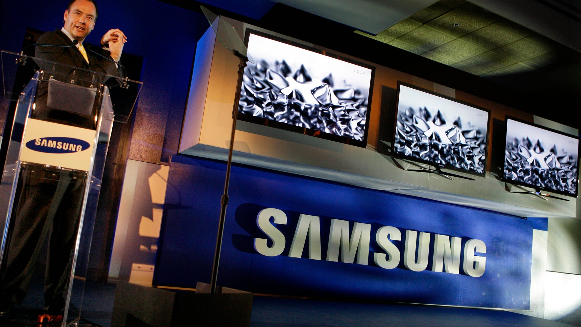 Samsung Consumer Electronics President Tim Baxter shows off flat screen technology at the Samsung news conference during the International Consumer Electronics Show (CES) in Las Vegas on Wednesday, Jan. 6, 2010.