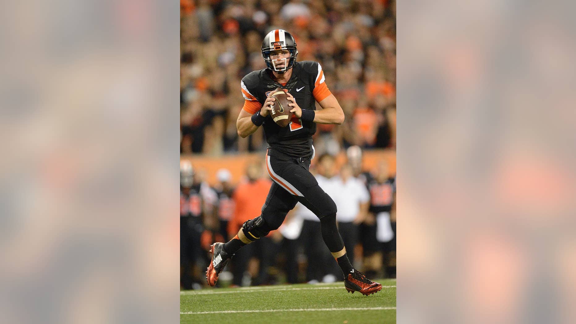 Oregon State quarterback Sean Mannion (4) passes against San Diego State during the third quarter of an NCAA college football game in Corvallis, Ore., Saturday, Sept. 20, 2014. (AP Photo/Troy Wayrynen)