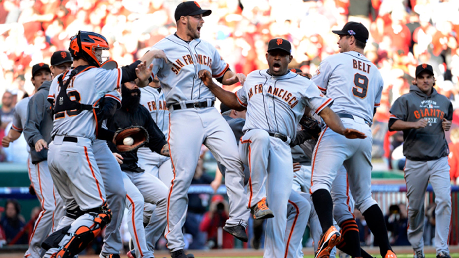 The San Francisco Giants celebrate after they defeated the Cincinnati Reds 6-4 in Game 5 of the National League division baseball series, Thursday, Oct. 11, 2012, in Cincinnati. The Giants won the final three games, all in Cincinnati, and advanced to the NL championship series. (AP Photo/Michael Keating)