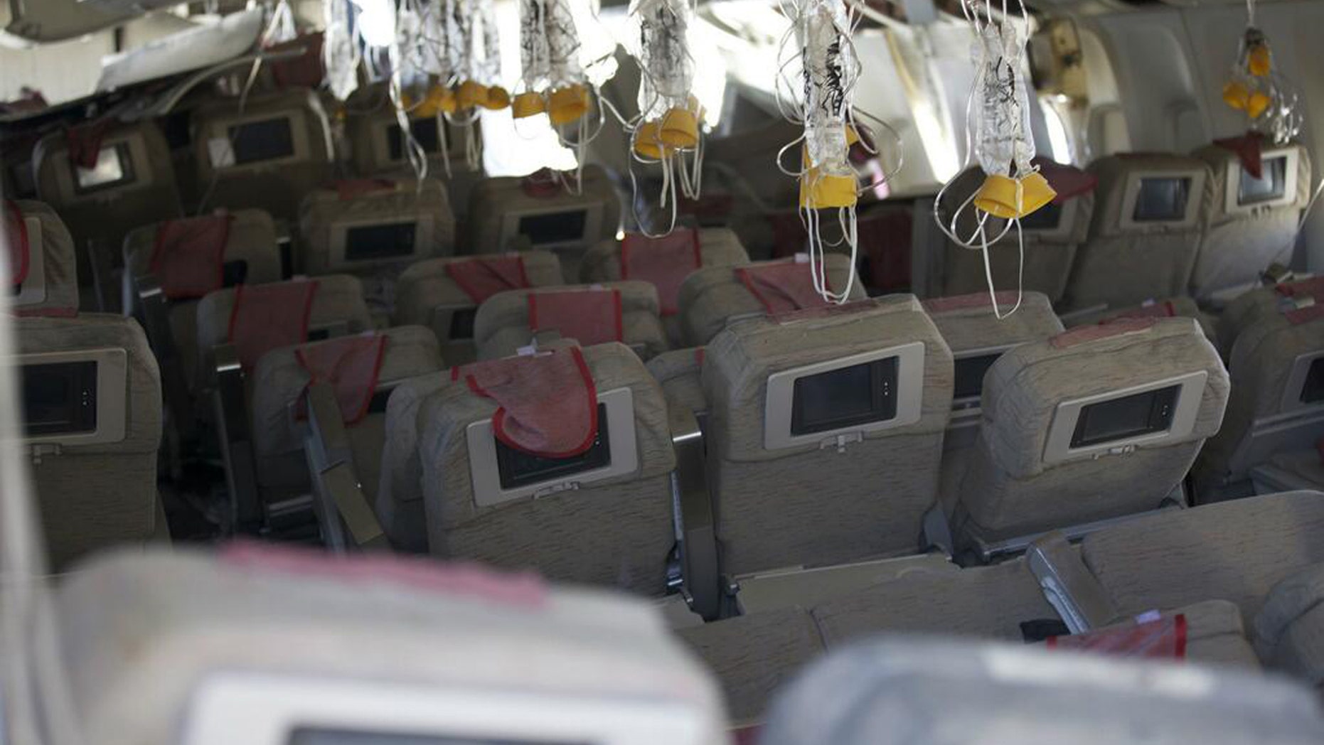 This image released by the National Transportation Safety Board, Sunday, July 7, 2013, shows the interior of the Boeing 777 Asiana Airlines Flight 214 aircraft.
