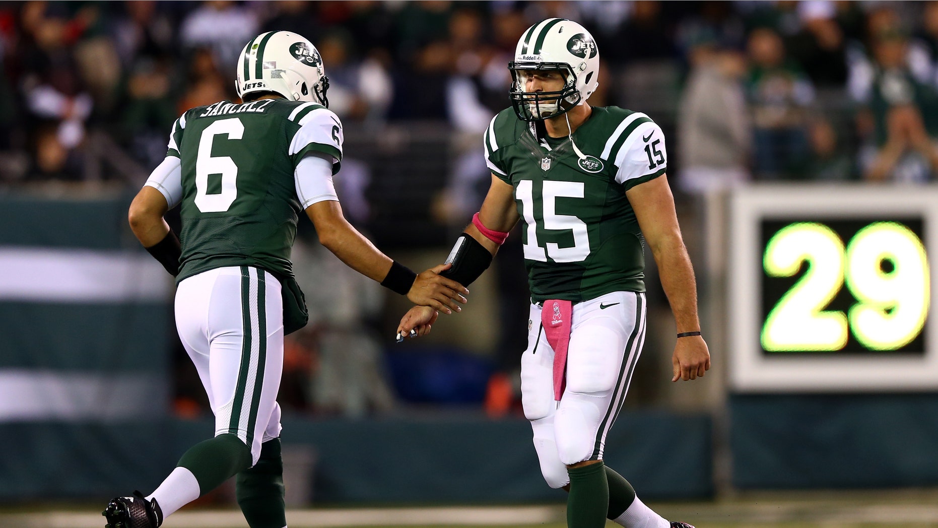 EAST RUTHERFORD, NJ - OCTOBER 08: Quarterback Mark Sanchez #6 of the New York Jets re-enters the game to replace Tim Tebow #15 in the first quarter against the Houston Texans at MetLife Stadium on October 8, 2012 in East Rutherford, New Jersey. (Photo by Elsa/Getty Images)