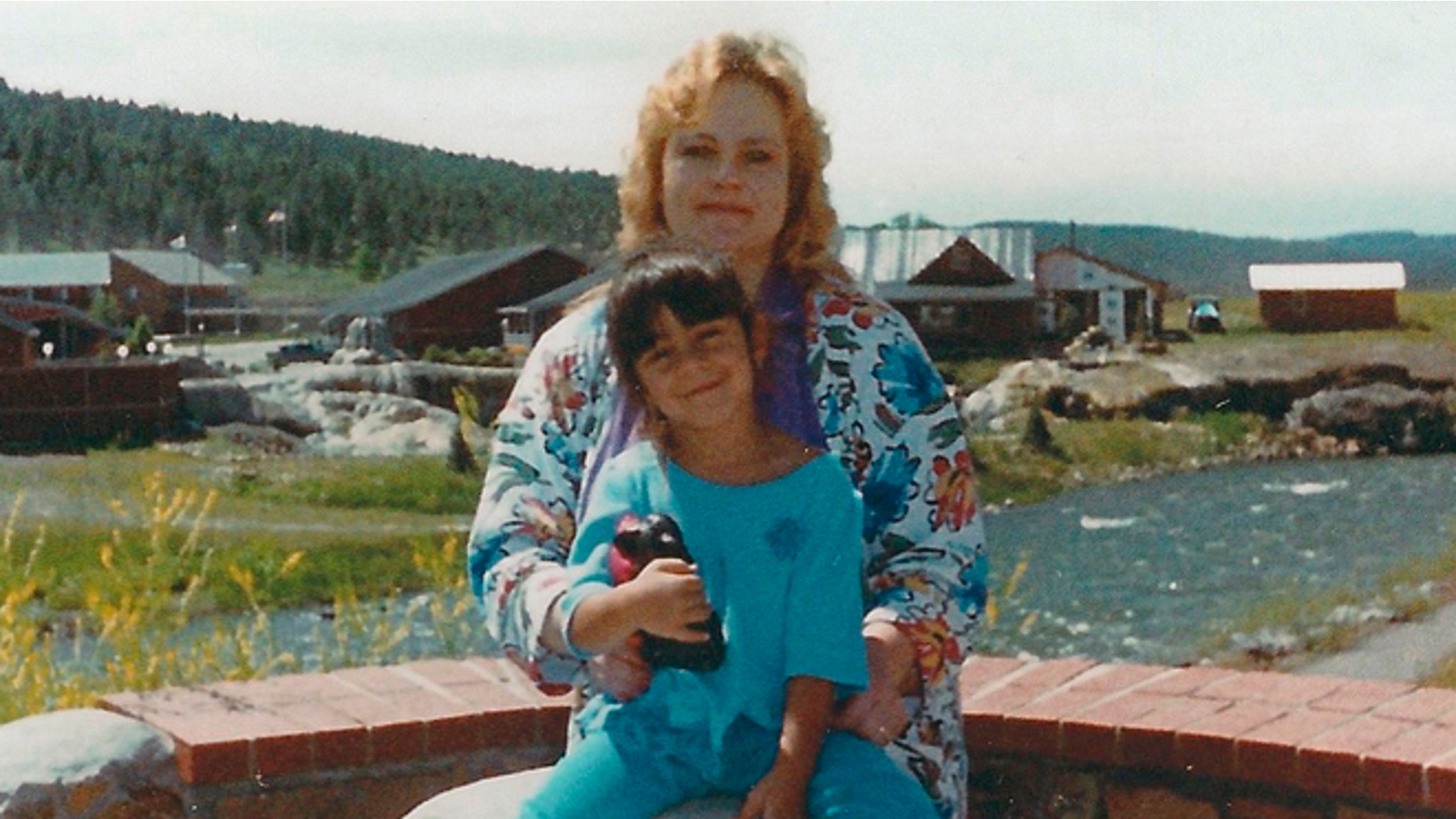 Laura Miera is seen with her daughter Cassandra. In 2002, a tractor-trailer overturned, burying Laura Miera's car in sand and suffocating her inside, in Albuquerque, N.M.
